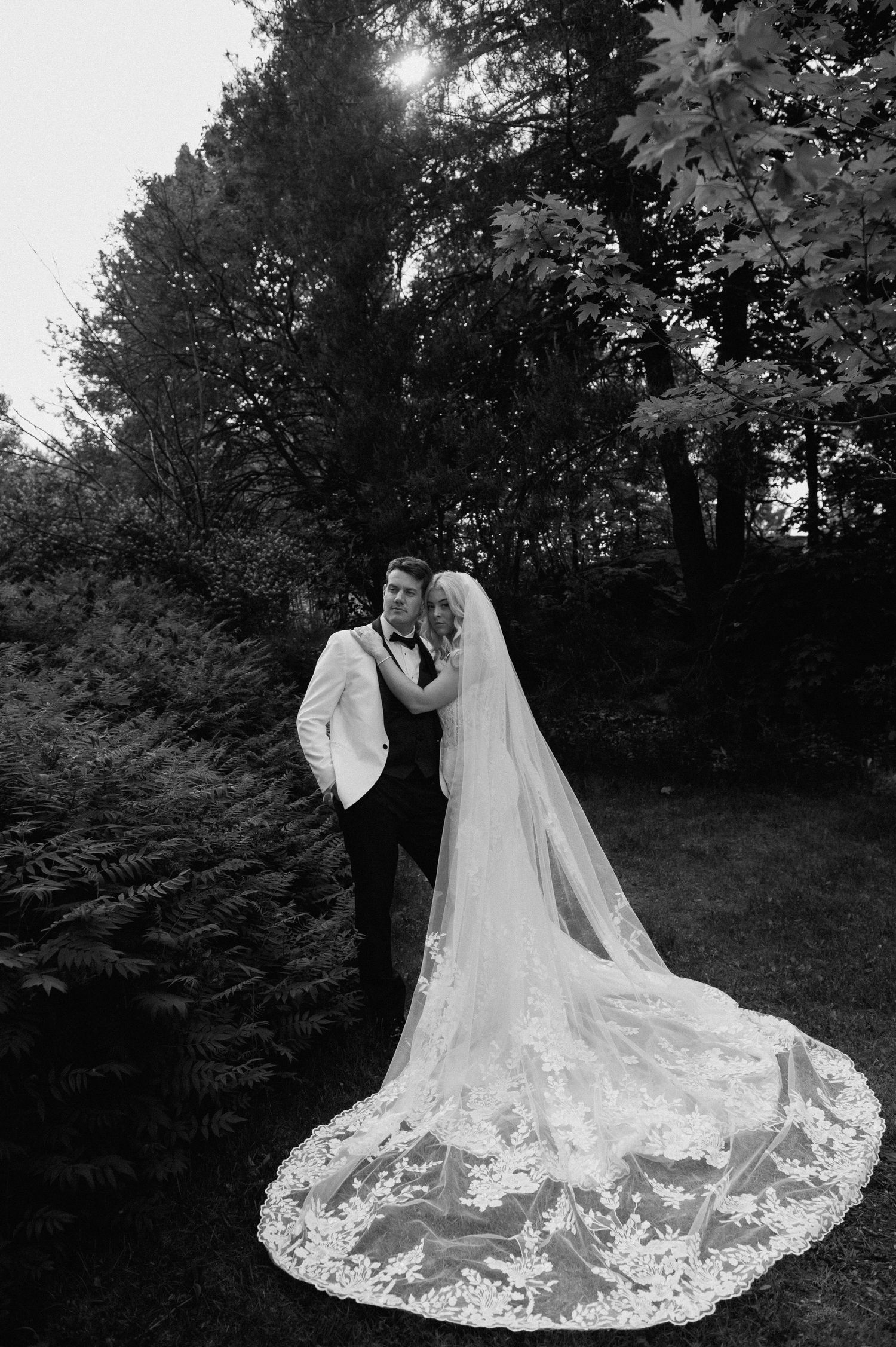 Black and white wedding photos showcasing intricate lace dress details.
