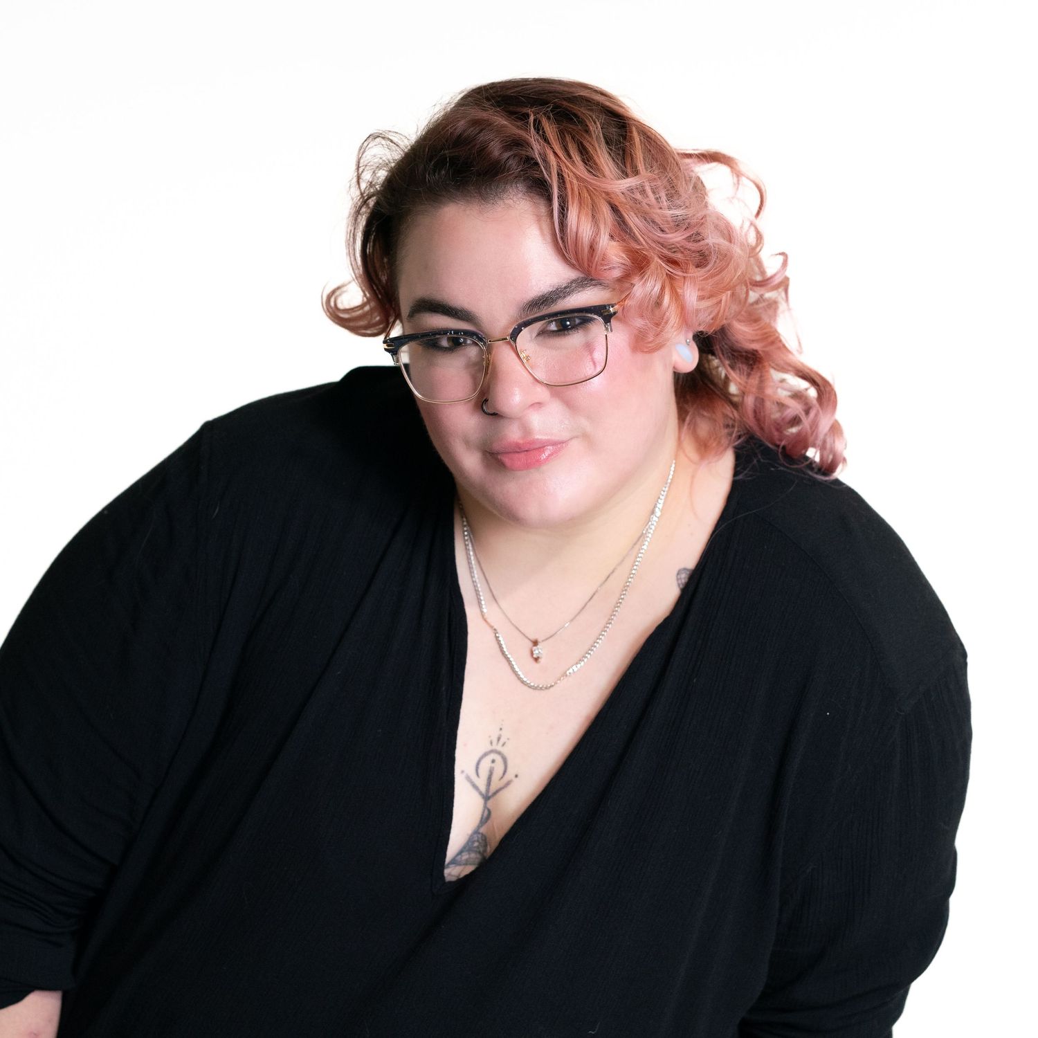 Portrait series of a person in black against white background showing different poses.