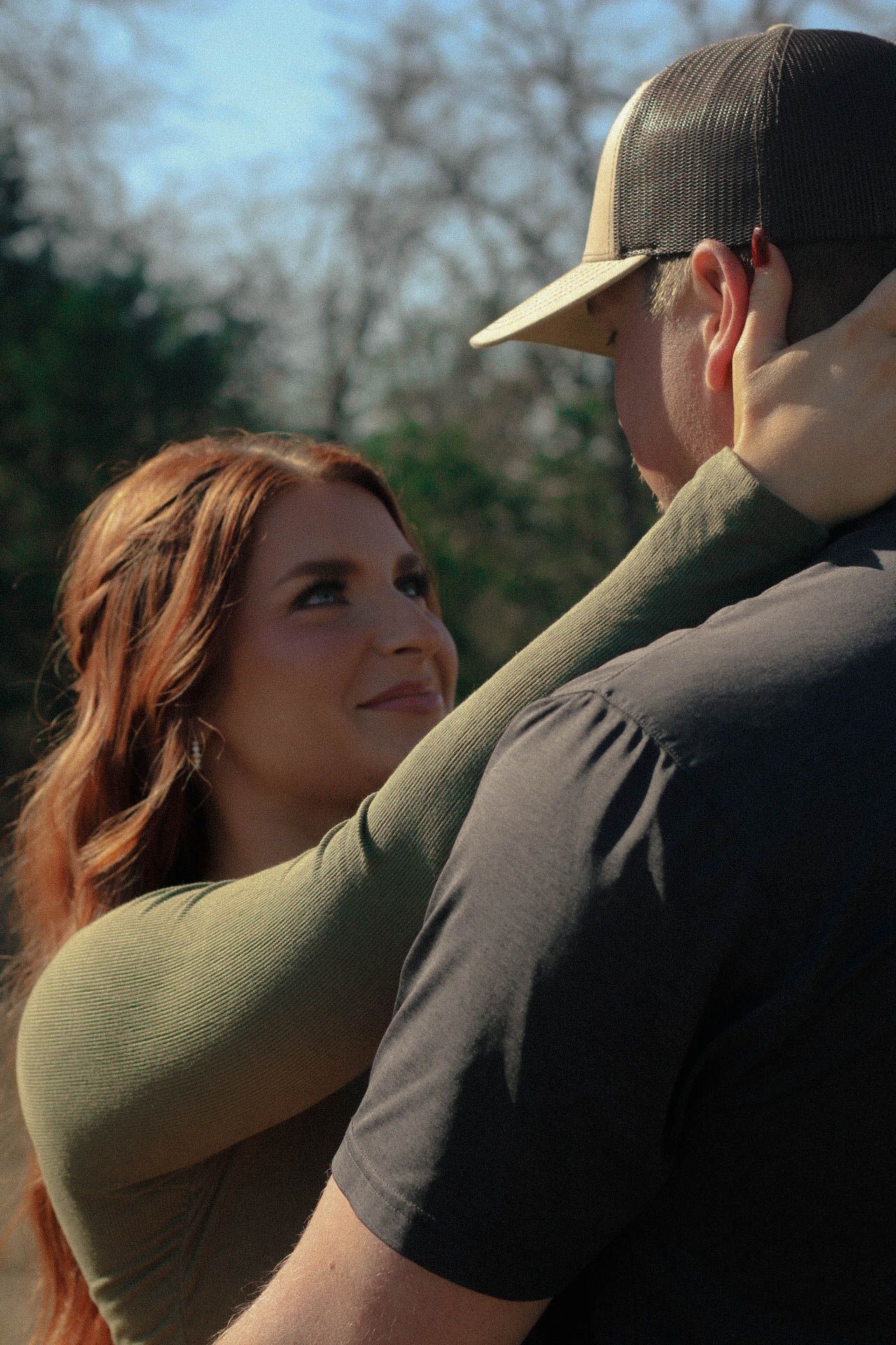 Romantic outdoor photoshoot at sunset with warm lighting.