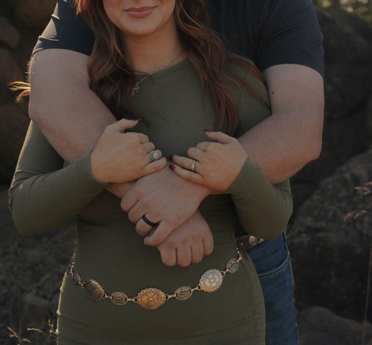 A warm embrace captured at golden hour with decorative accessories.
