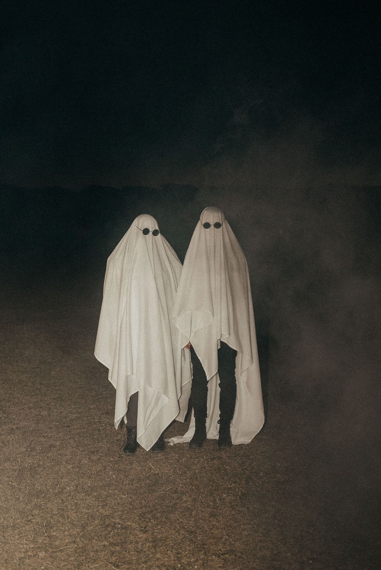 Best friends dressed in sheets for Halloween photo shoot in Calgary