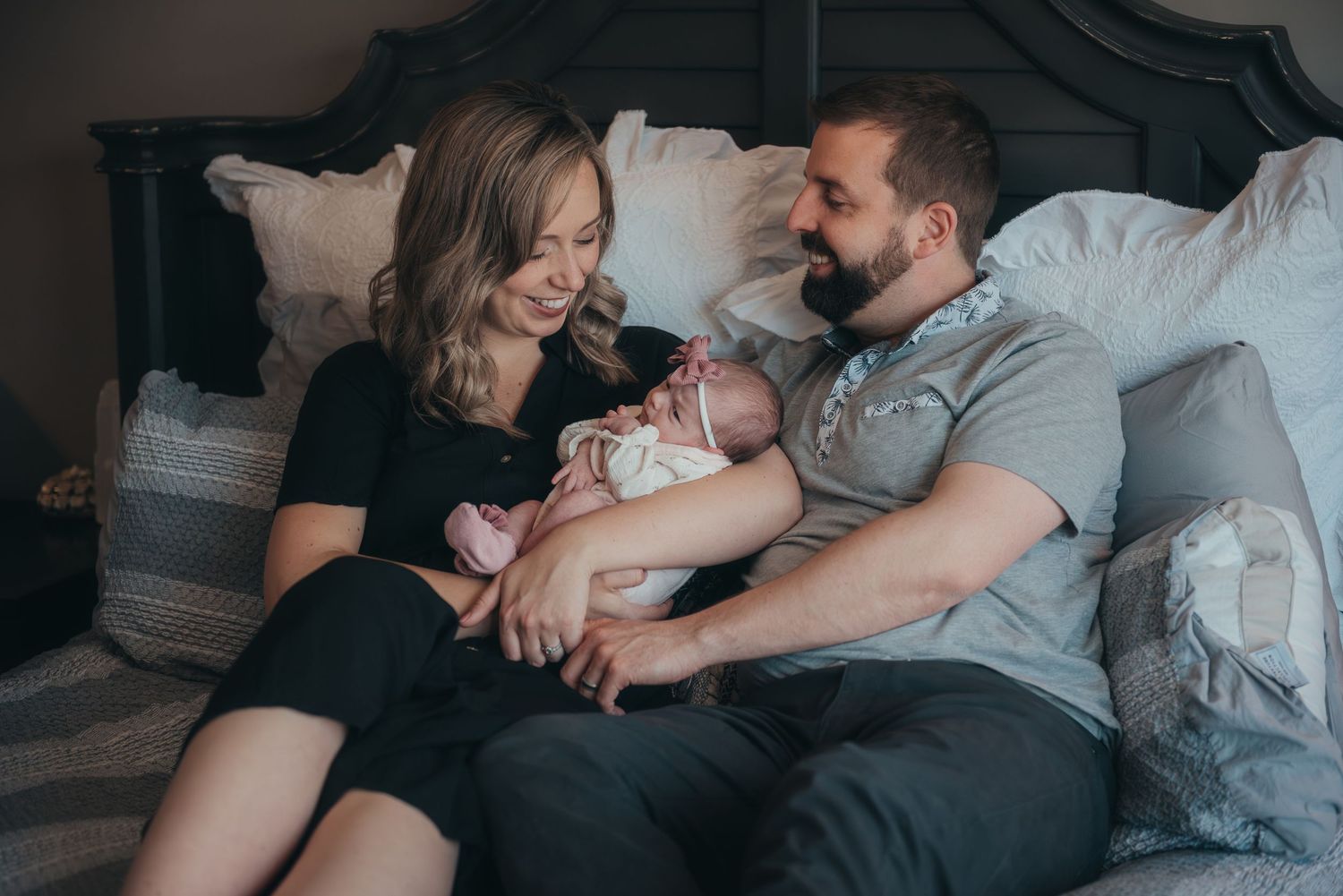 Lifestyle family photography session showing intimate moments with newborn.