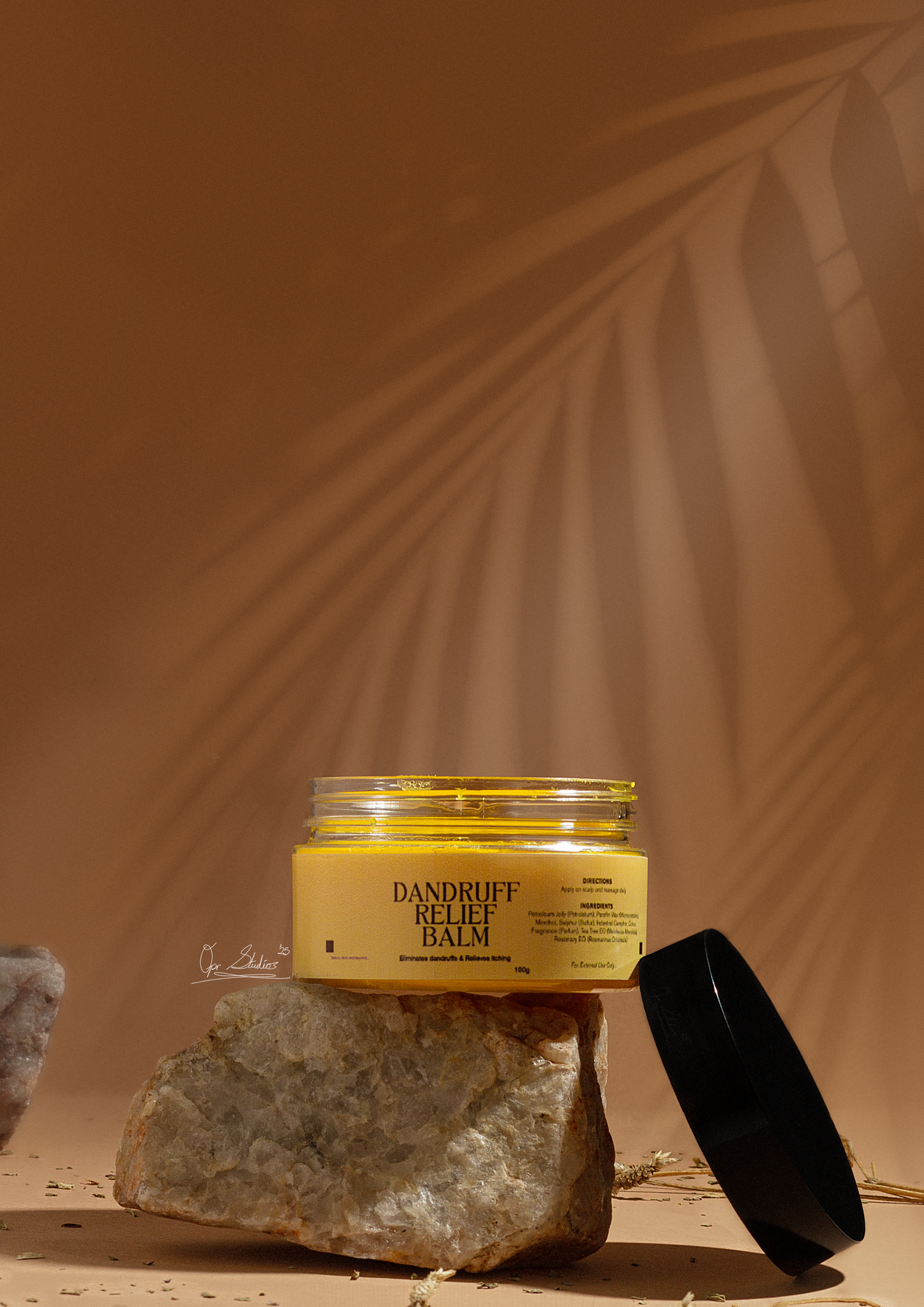 Studio editorial product photoshoot of Beyond Surface dandruff relief balm