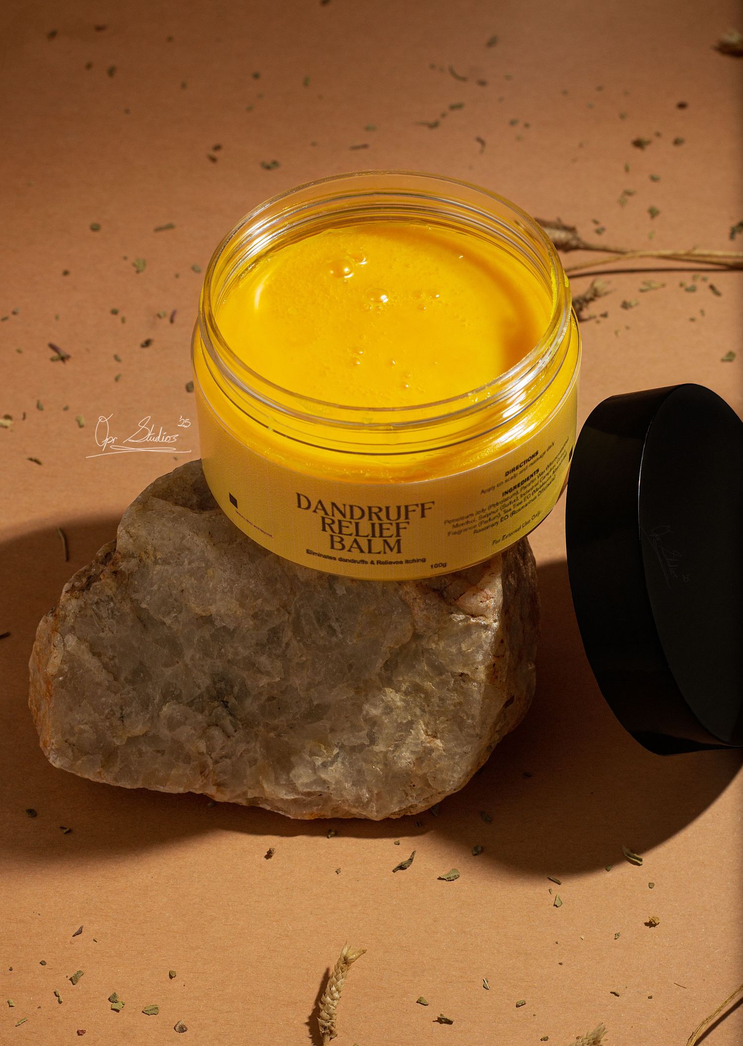 Studio editorial product photoshoot of Beyond Surface dandruff relief balm shot at angle 45