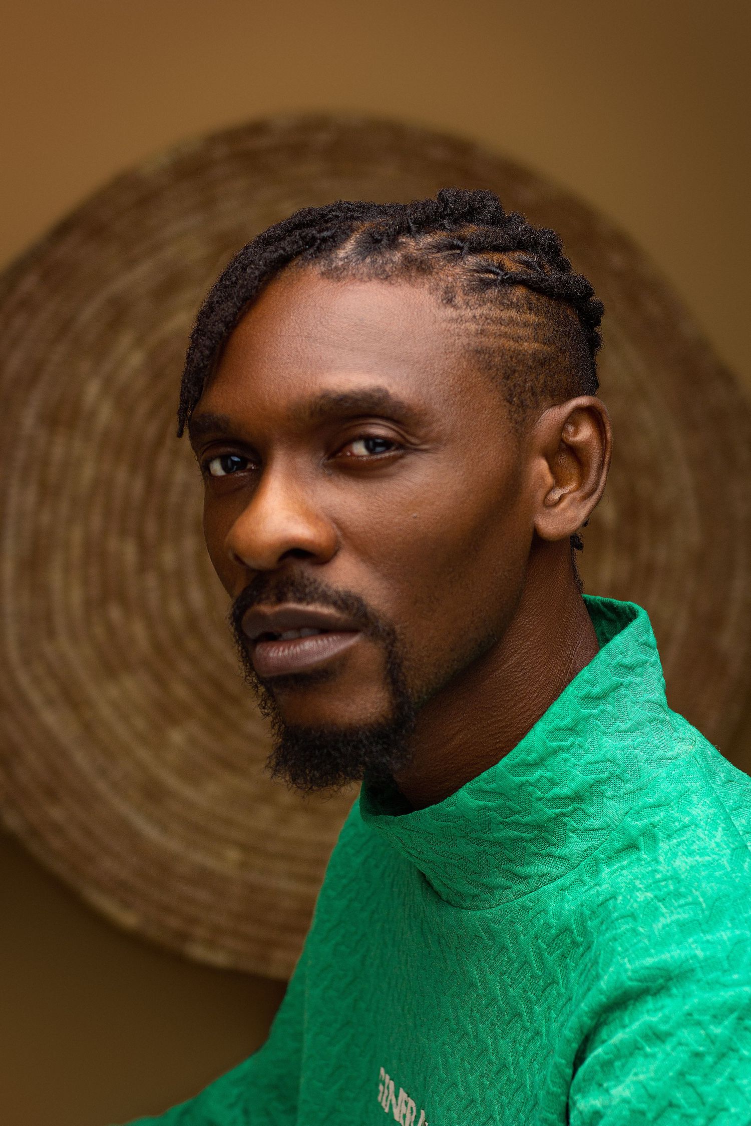 Headshot of a young black creative Nigerian man