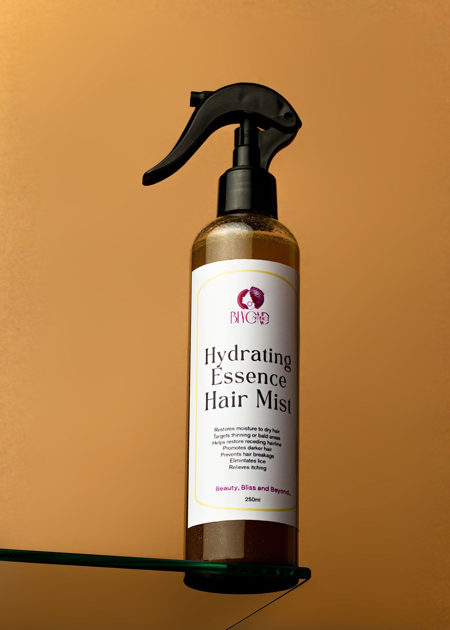 Studio editorial product photoshoot of Beyond Surface hydrating essence hair mist shot a little below eye level