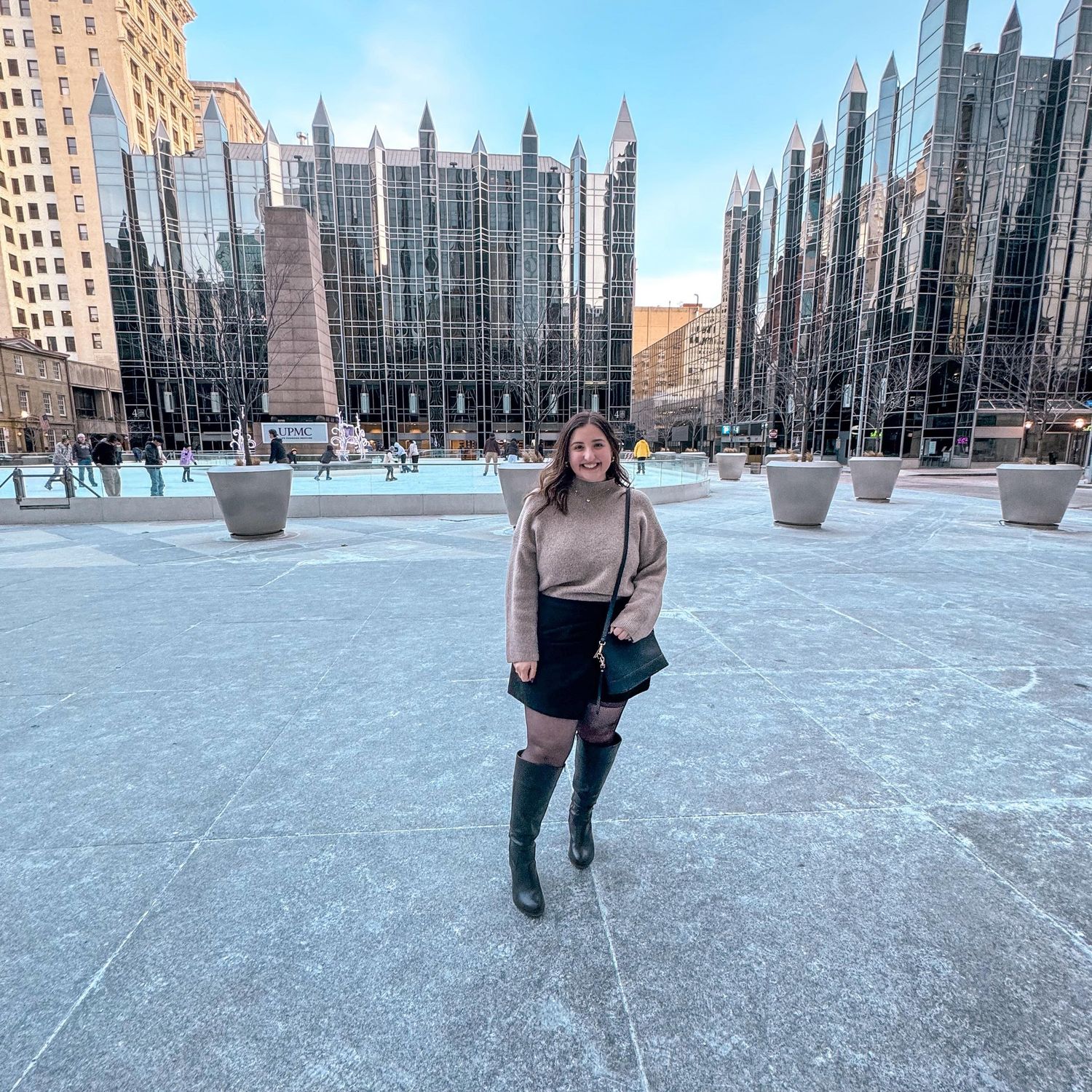 Pittsburgh wedding content creator Kaitlyn Mayer of KM Content Studio smiling and working behind the scenes at a wedding