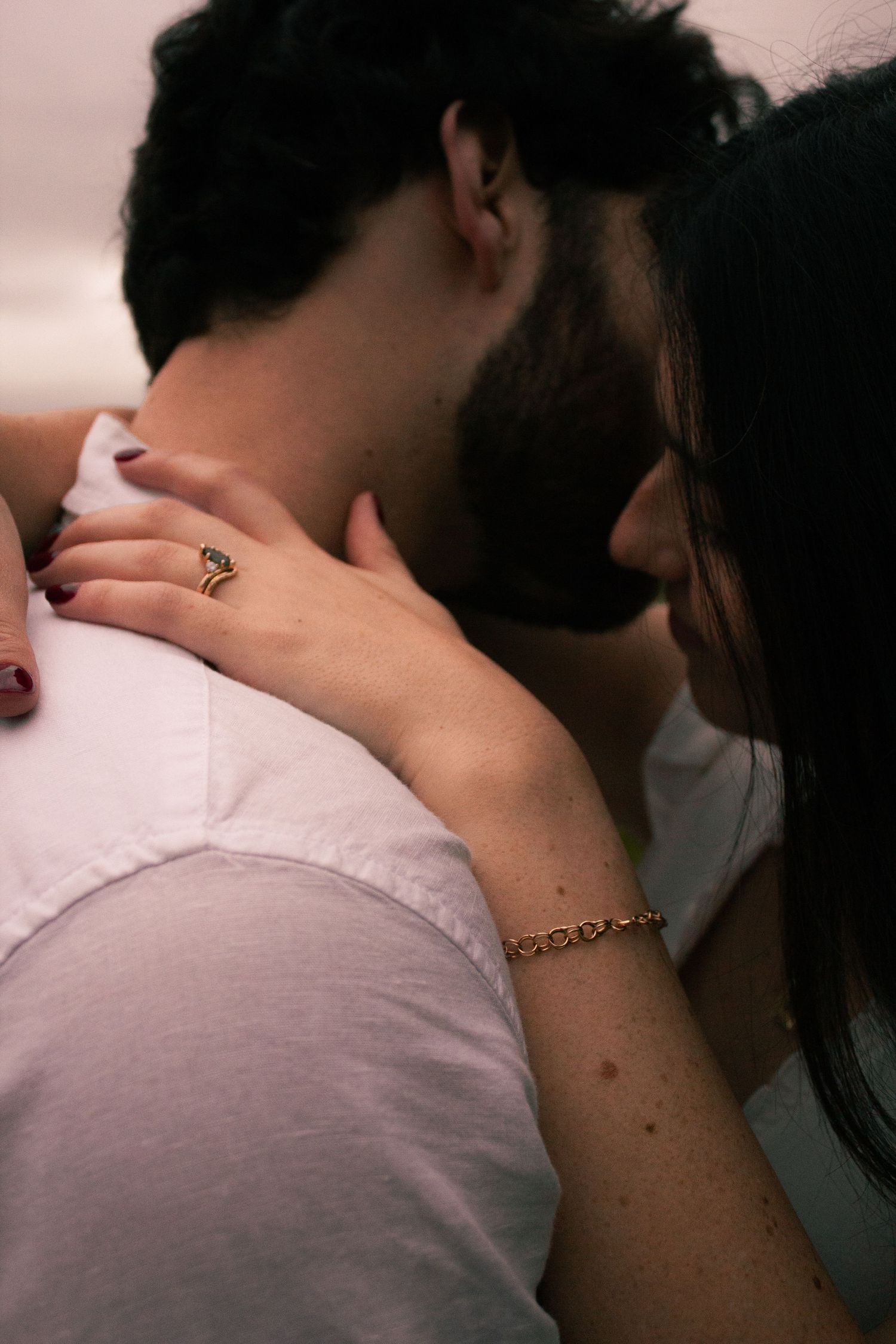 A romantic couple embraces intimately in a series of close-up shots showing affectionate moments.