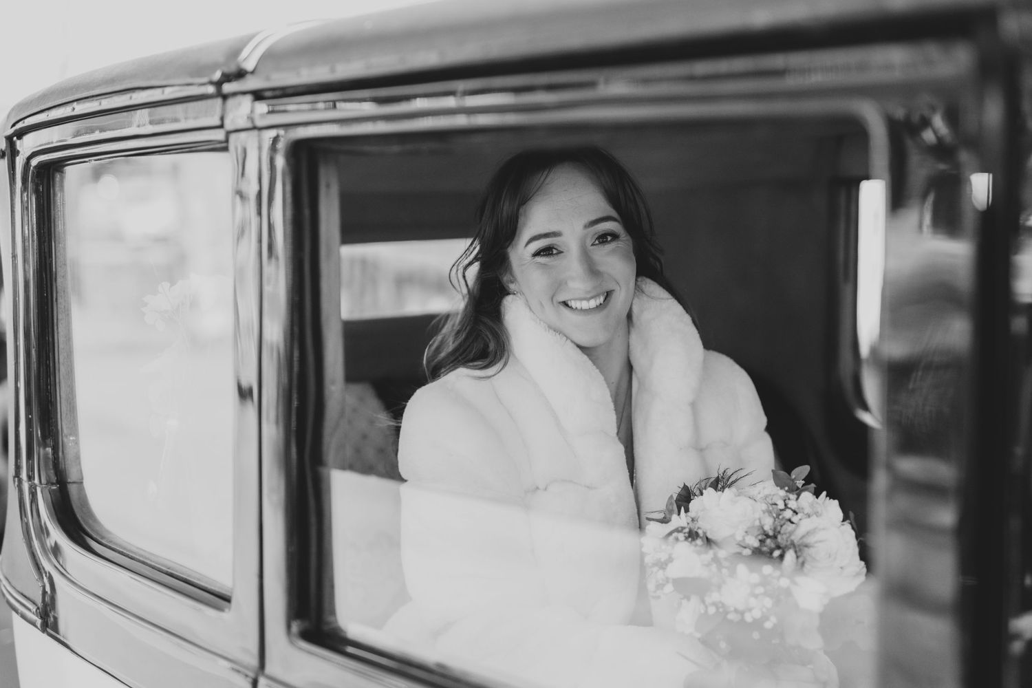 Vintage car wedding photography sequence in classic black and white style.