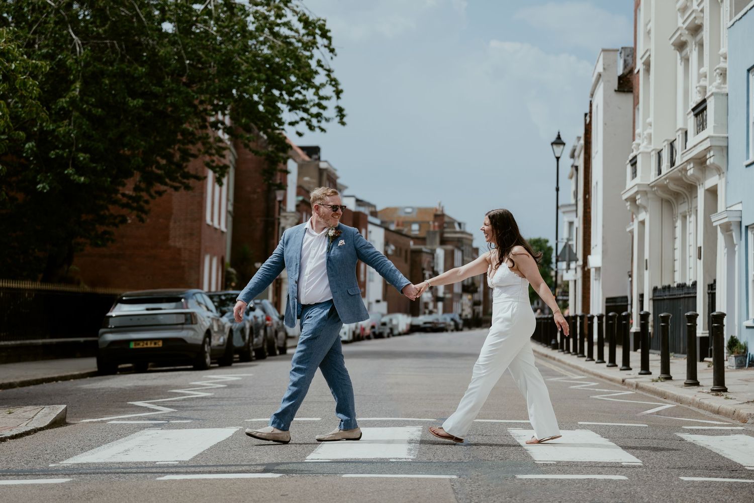 Creative urban wedding photography sequence showing couple walking down residential street.