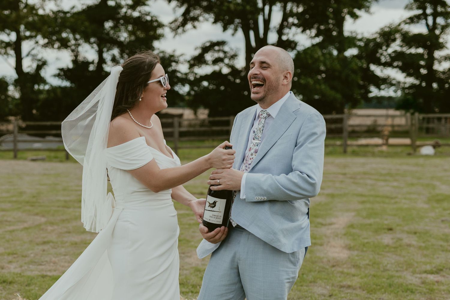 Couple sharing a romantic dance moment outdoors in a field.