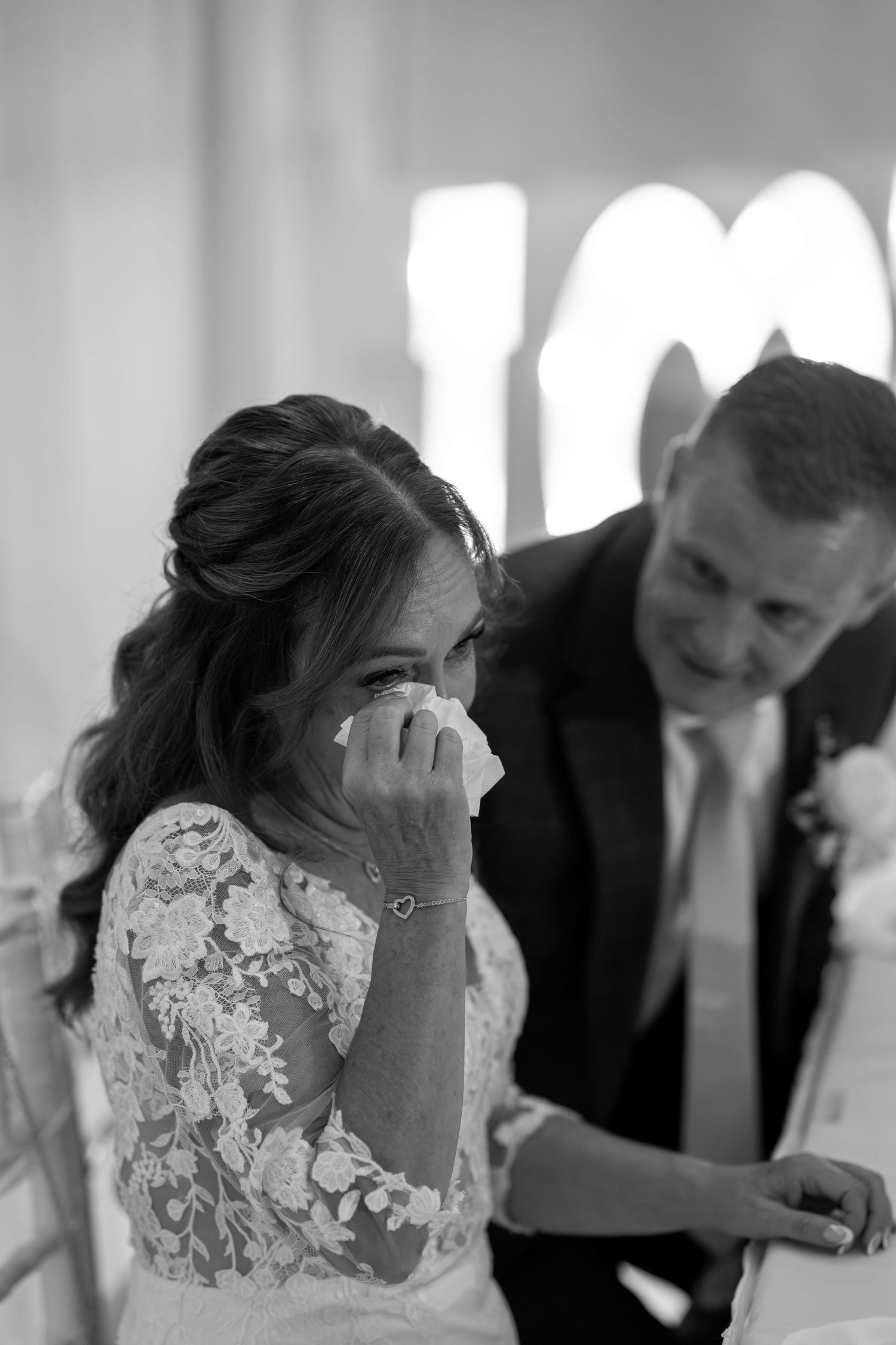 Artistic black and white wedding portrait sequence showing intimate moments.