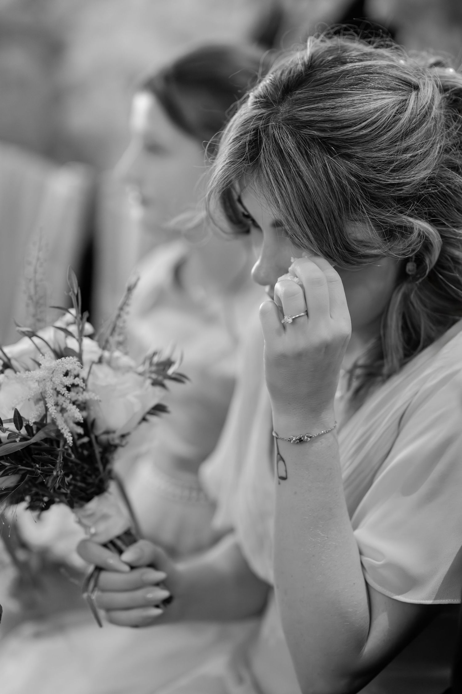 Black and white candid photos of wedding party preparations.