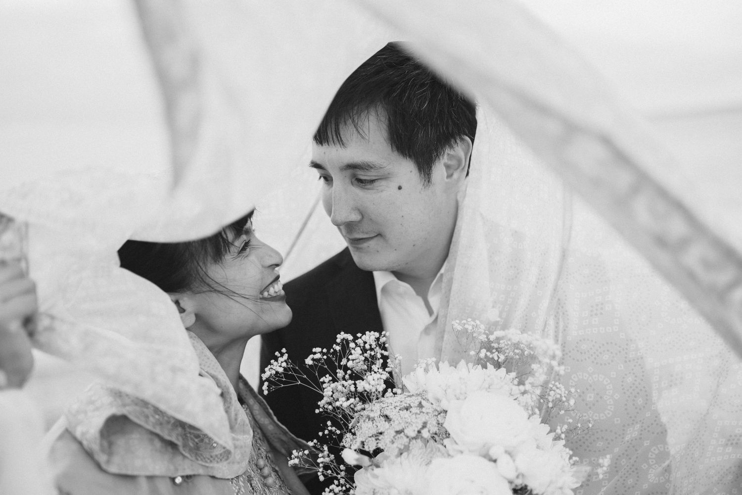 Romantic wedding photo series with soft lighting and delicate floral details.