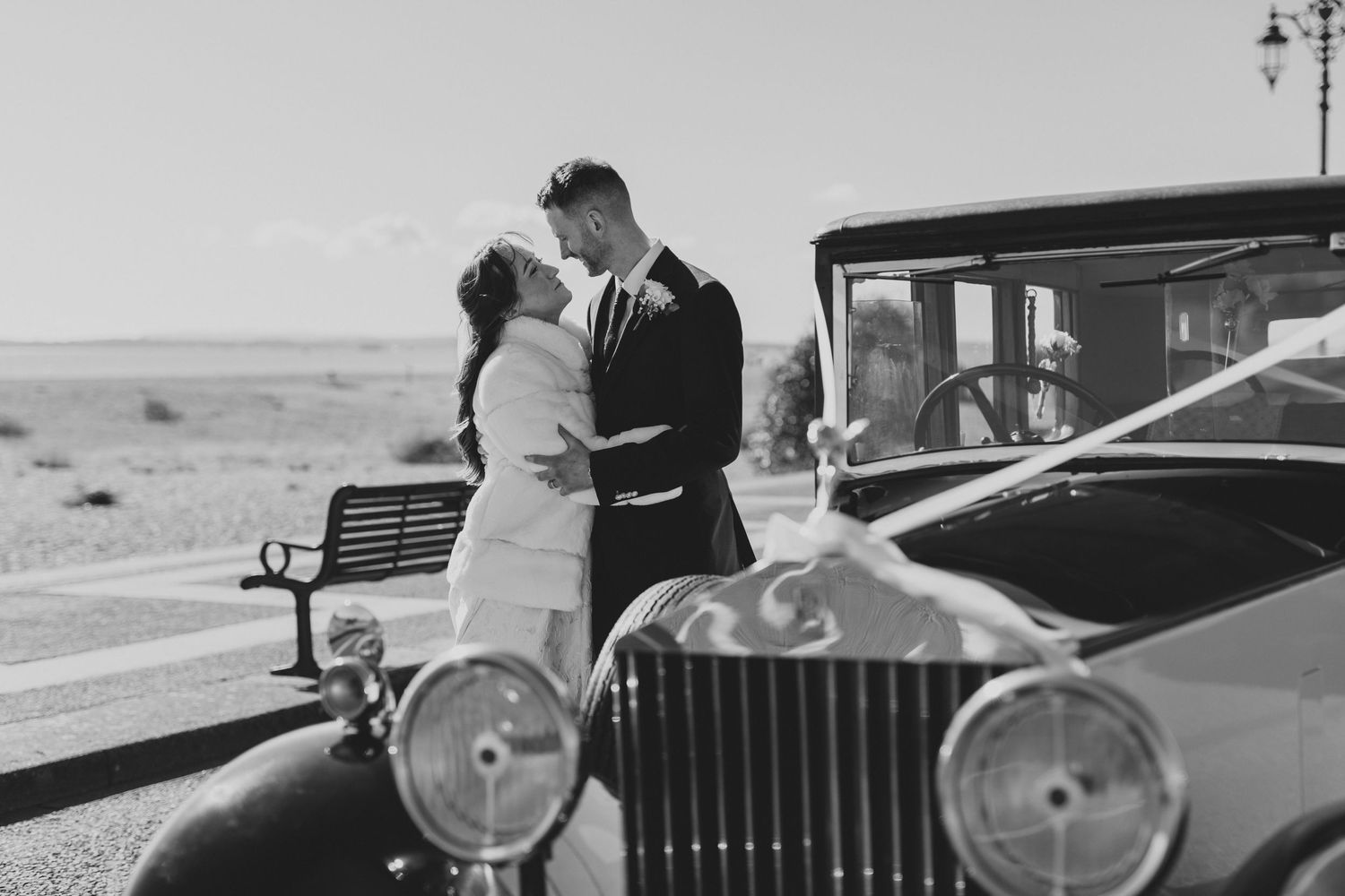 A sequence of classic black and white photographs featuring vintage automobiles and formal occasions.