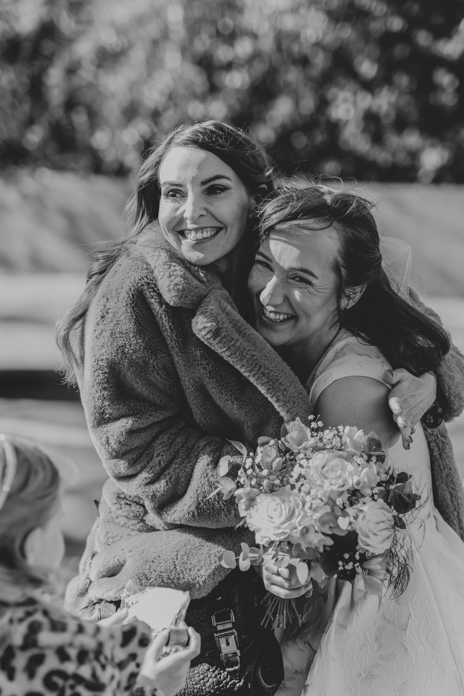 Candid black and white shots of joyful wedding moments with bouquets and laughter.