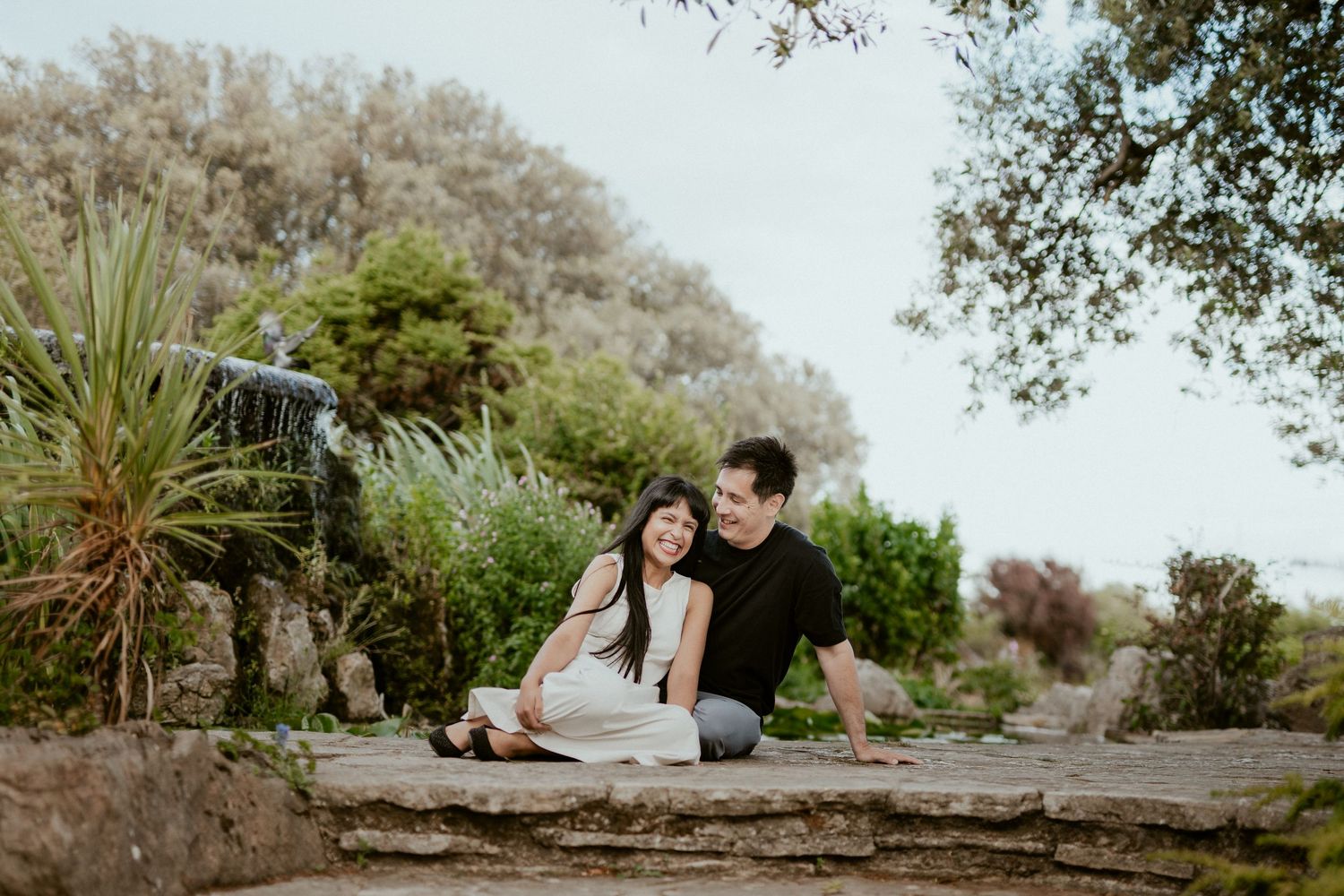 Panoramic series of a couple sharing intimate moments in a lush garden setting.