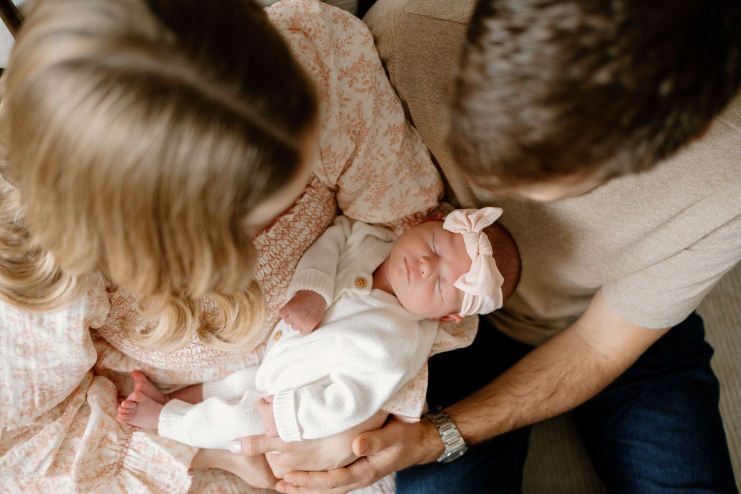 Close-up series of tender family moments with a baby in black and white tones.