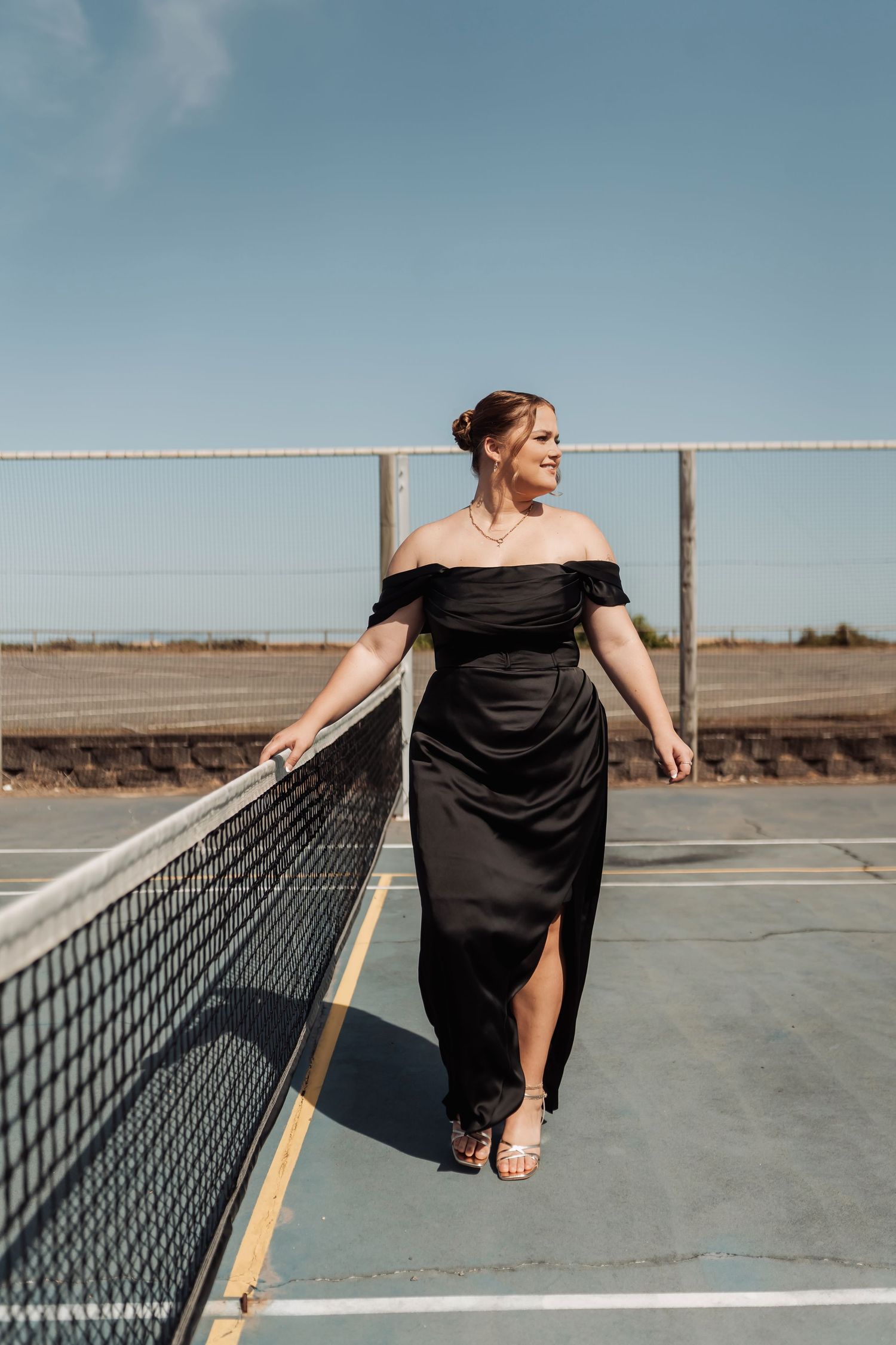 Artistic photo series showing a person in black dress posing against a concrete surface with geometric lines.