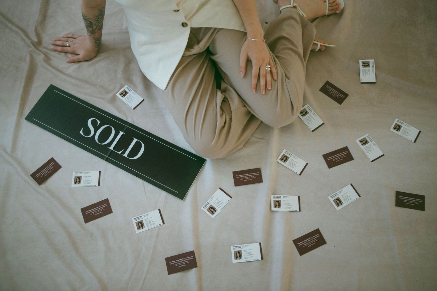 Scattered business cards and marketing materials lay on fabric backdrop for branding session at The Studio Collective in New Holland, PA.