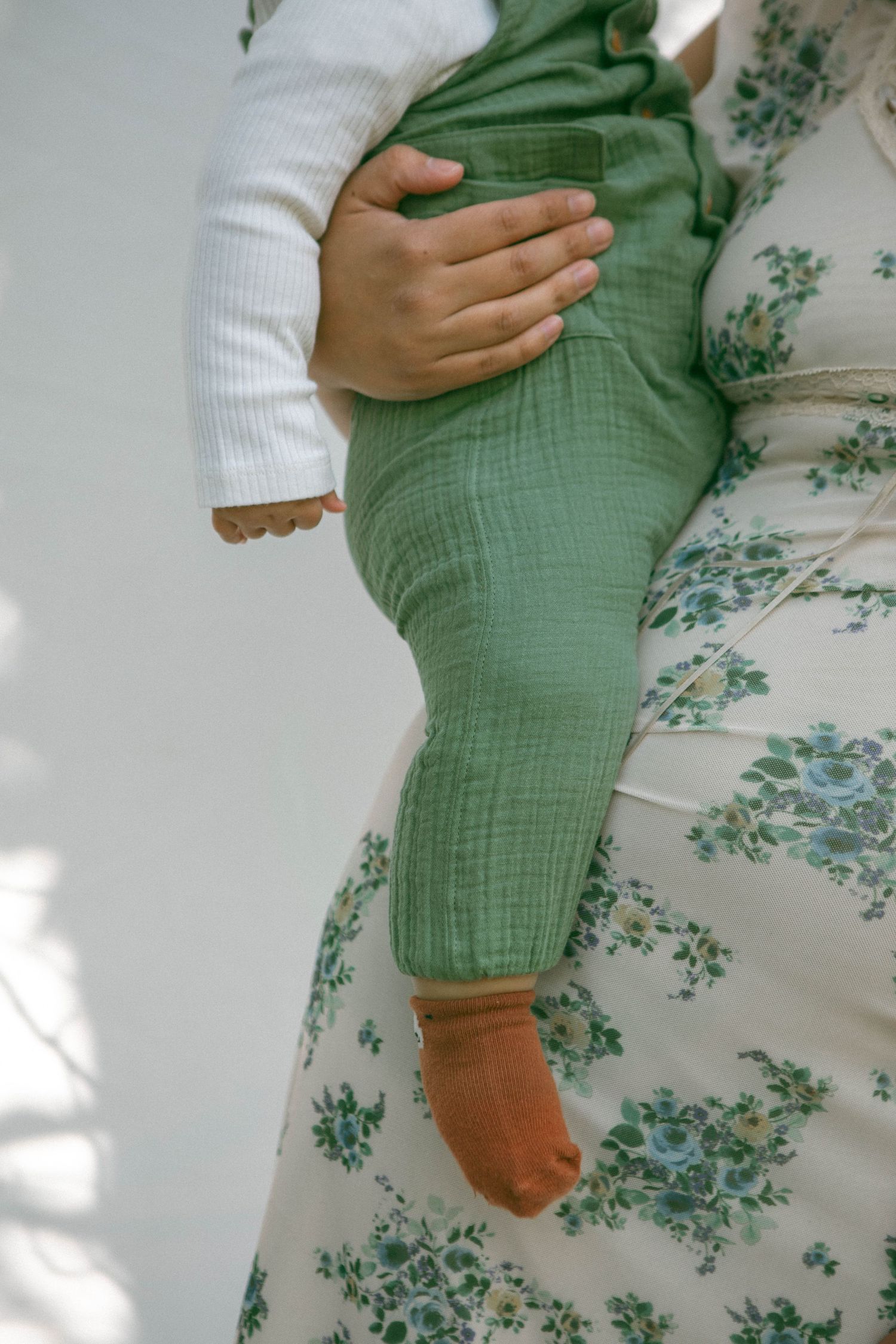 Mother embraces baby on her 