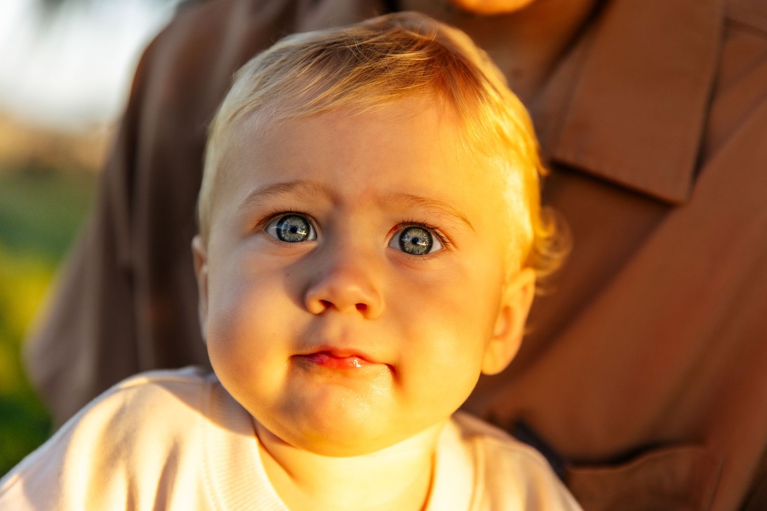 A collage of babies with bright blue eyes looking in different directions.