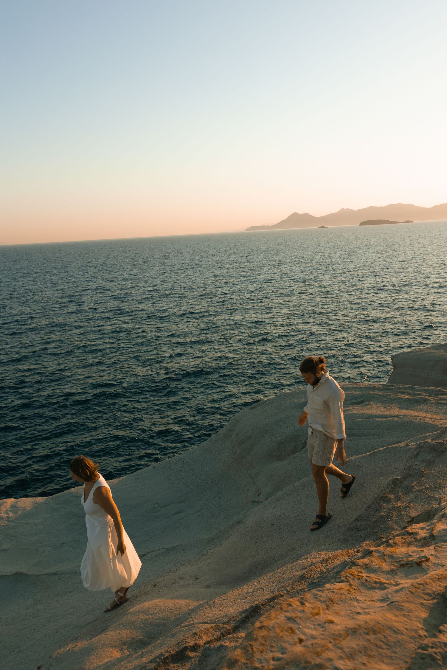 milos greece sarakiniko beach sunrise cliff jumping photo adventure session couple cinematic photography rebekah sage