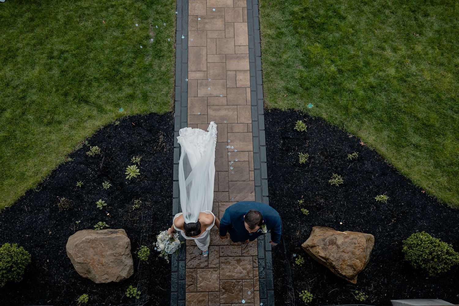 Aerial view of bride and groom walking down the aisle just married – joyful Pittsburgh wedding ceremony moment.