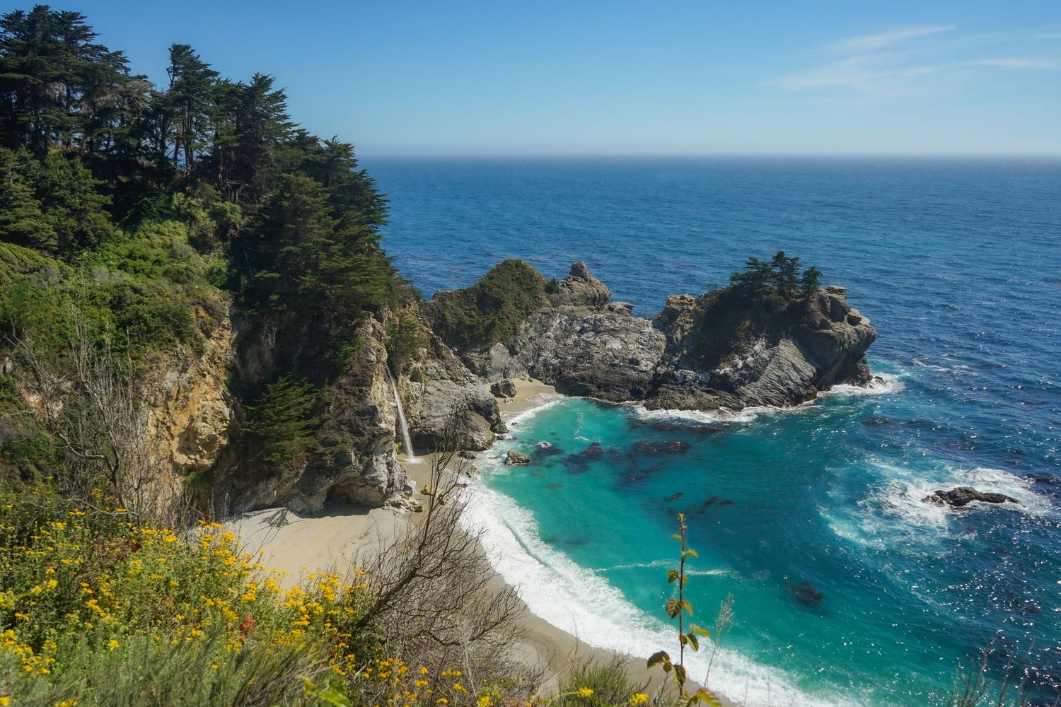 McVay Falls spills over the cliffs onto the beach in Big Sur, Ca.