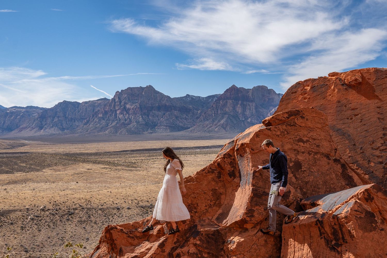A couple eloping in Red Rocks, Nevada with beautiful mountain scenery.