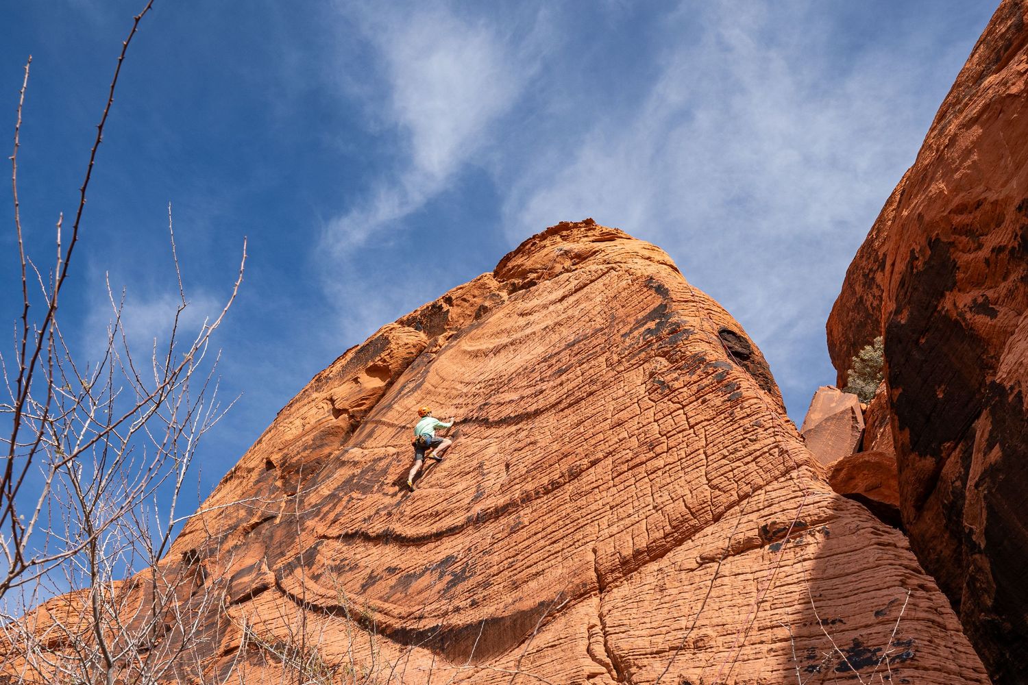A man climbing in Red Rocks Nevada on his wedding day.