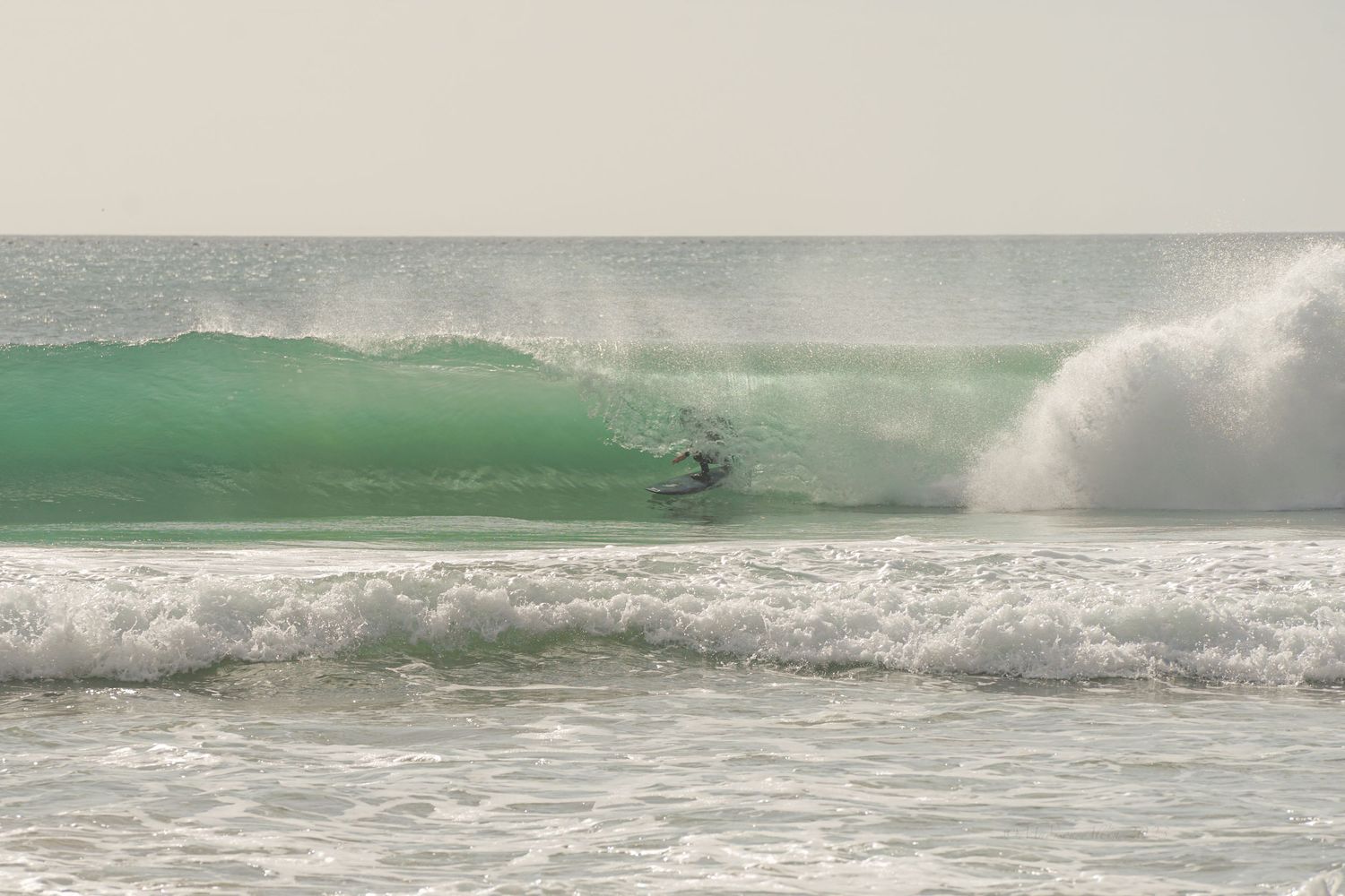getting barreled in the Algarve, Portugal. Surf elopement day