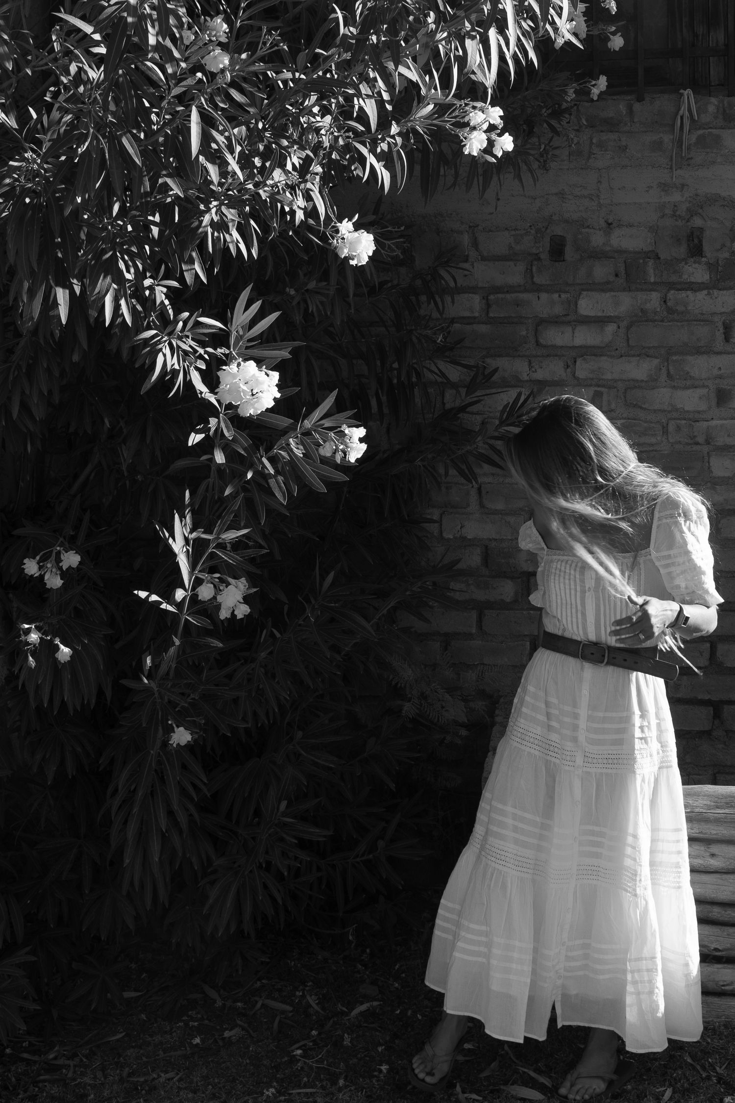 A bride poses next to beautiful flowers in Mendoza, Argentina.