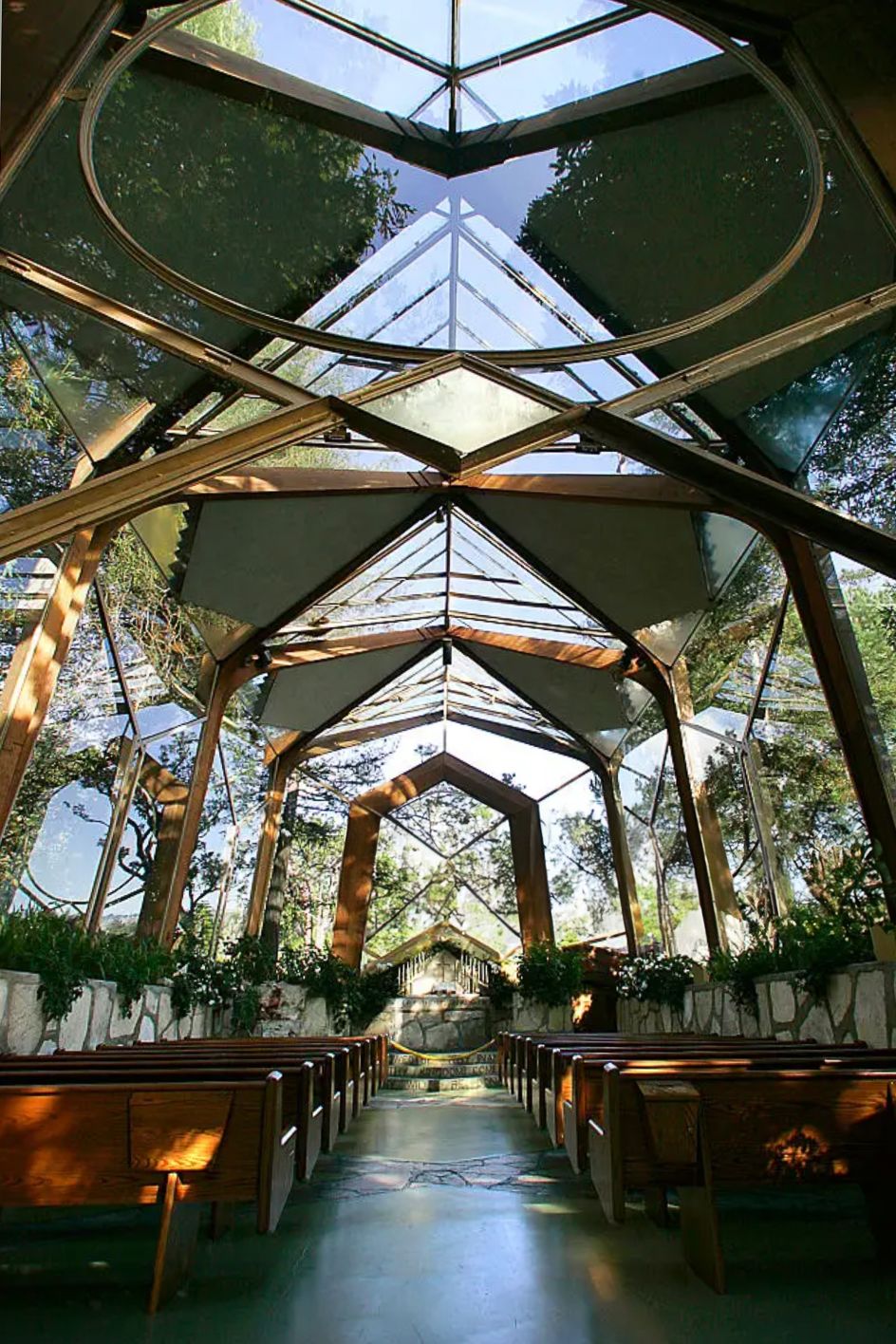 The glass roof of the Wayfarers chapel lets in lots of light and views of trees in Palos Verdes, California.