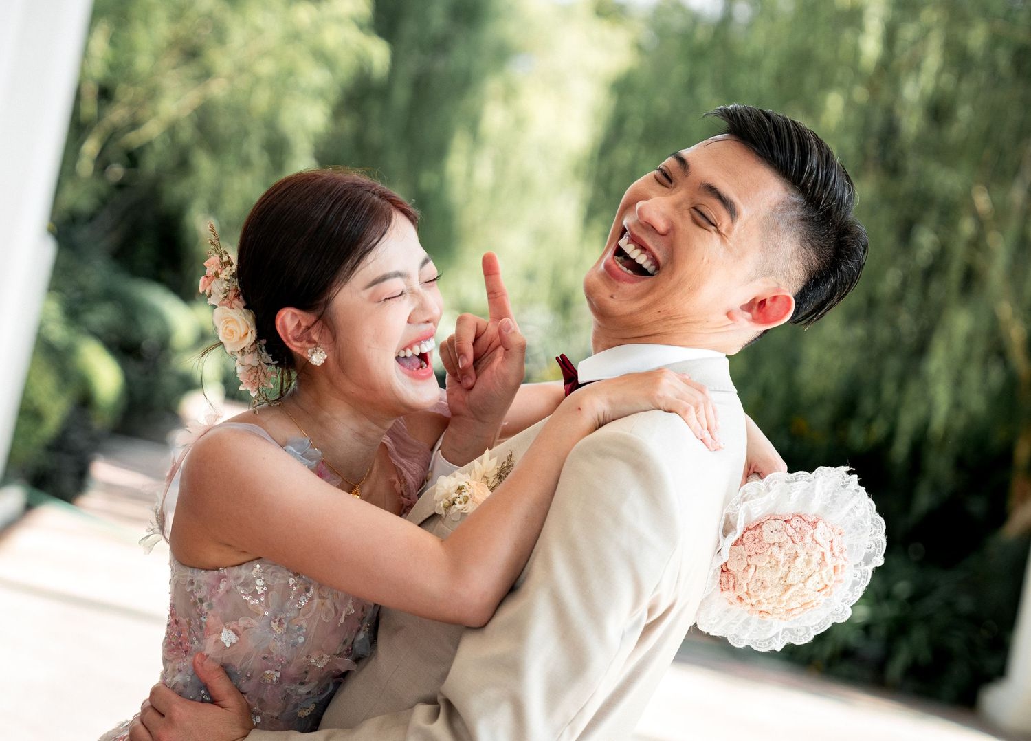 A series of candid romantic moments between a couple laughing and embracing in an outdoor setting with green foliage.