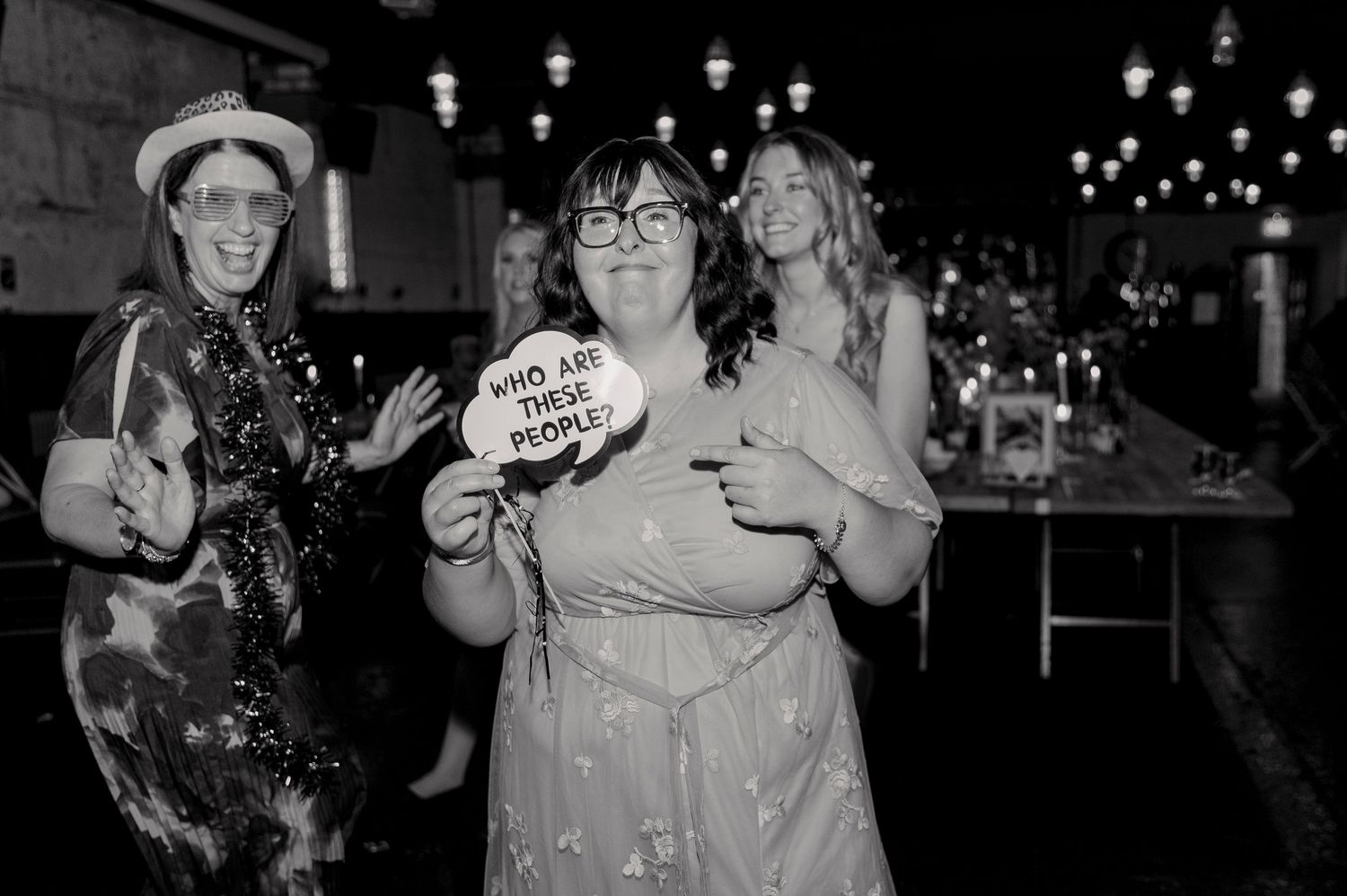 Black and white photos of people dancing and having fun at what appears to be a party or celebration event.