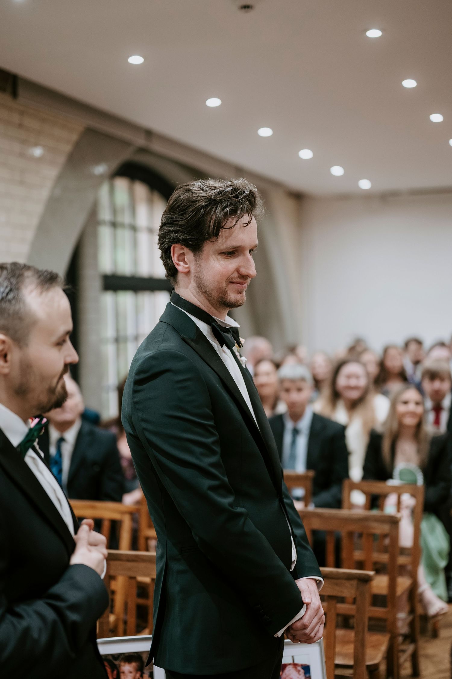 A series of candid moments showing a groom reacting emotionally during a church wedding ceremony.