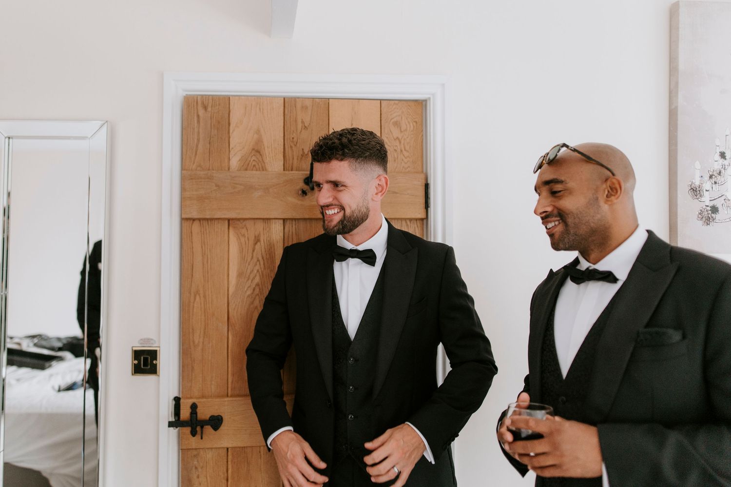 A series of five photos showing groomsmen in black suits preparing for a wedding ceremony.