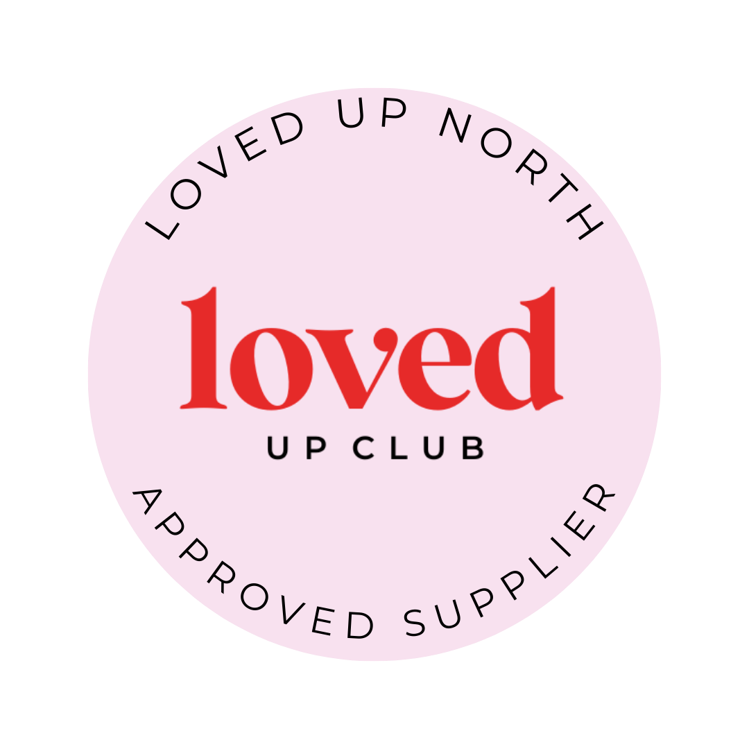 Pink circular logo for Loved Up Club approved supplier with red text on light pink background.