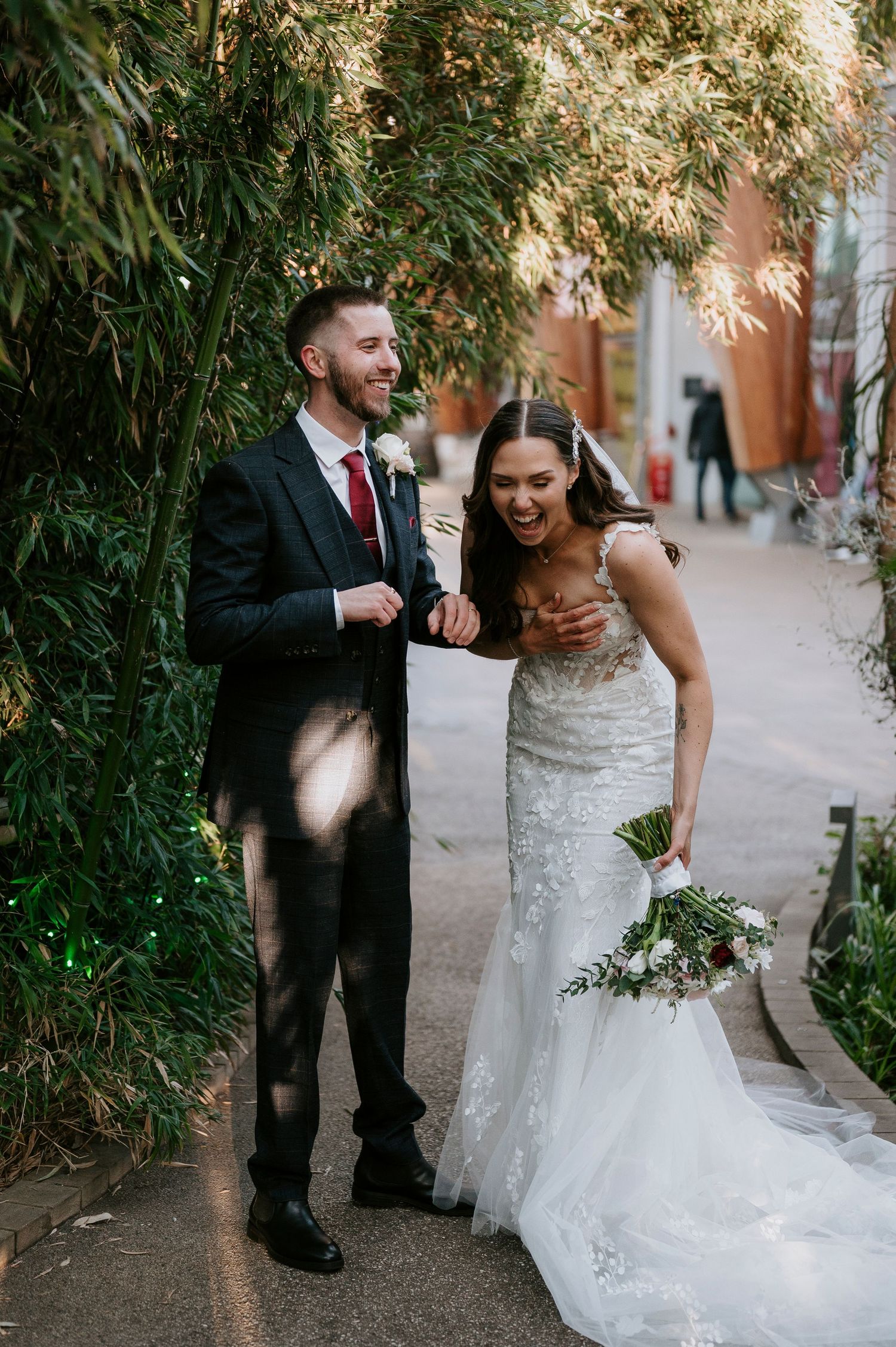 A candid sequence of wedding photos showing joyful moments between newlyweds in a garden pathway setting.