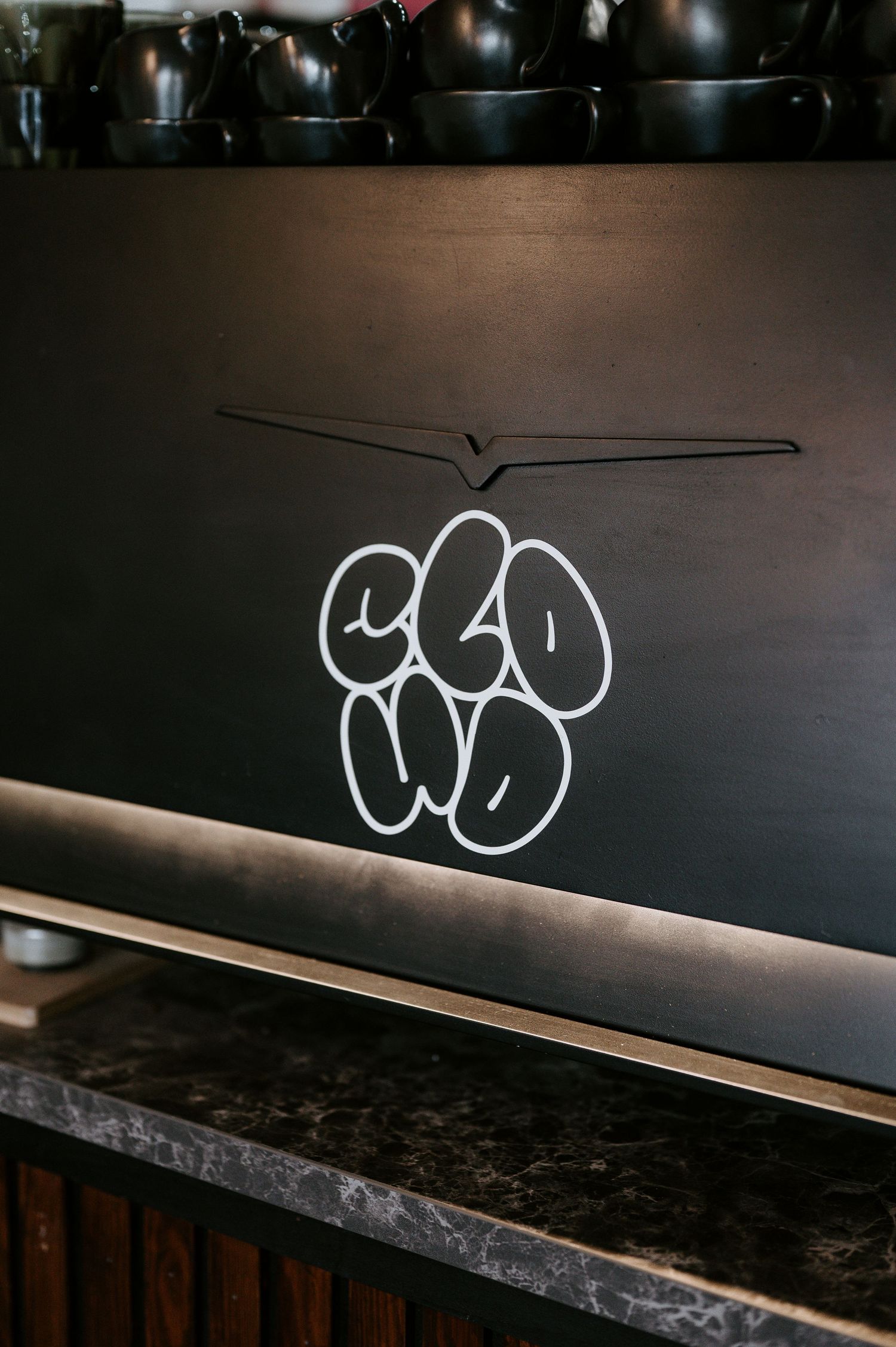 A sequence of minimalist white chalk drawings showing simple line art and doodles on a dark chalkboard surface.