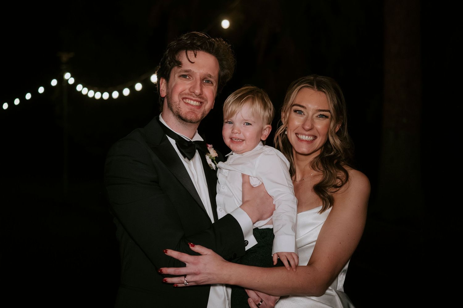 A series of black and white wedding photos showing a couple and child in formal attire during a celebration.