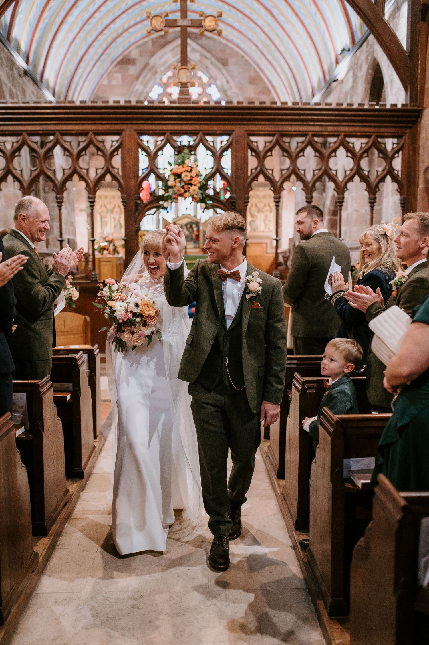A sequence of candid moments during a church wedding ceremony showing joyful interactions between people in formal attire.