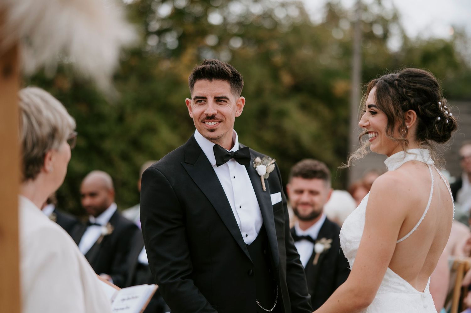 A collection of candid wedding moments shows a couple and guests celebrating outdoors during a formal ceremony.