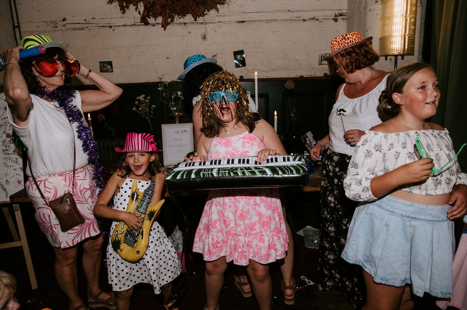 People dancing and socializing at what appears to be a casual party or gathering.
