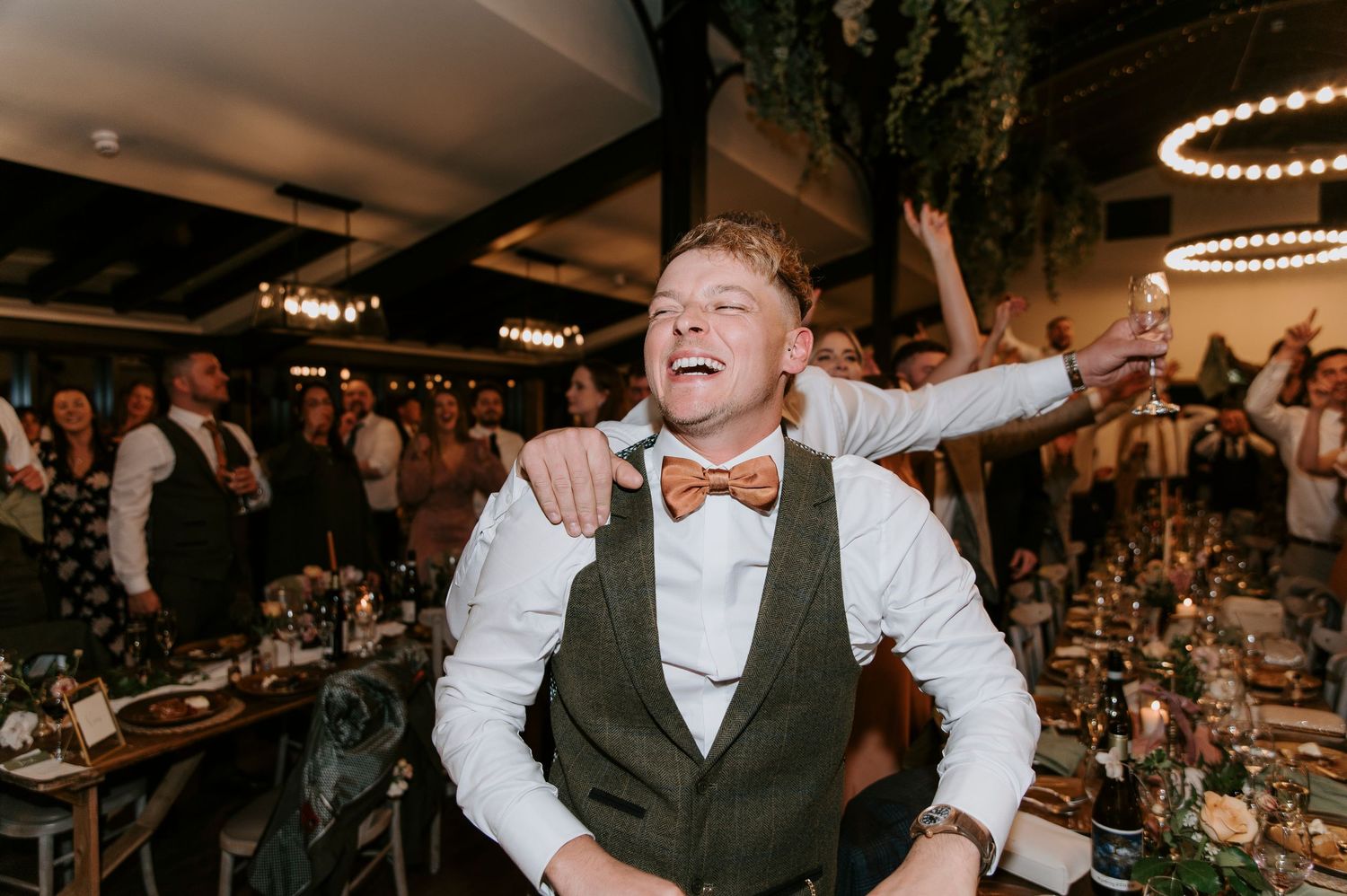 A series of candid dance floor moments at a wedding reception showing guests celebrating with joyful expressions.