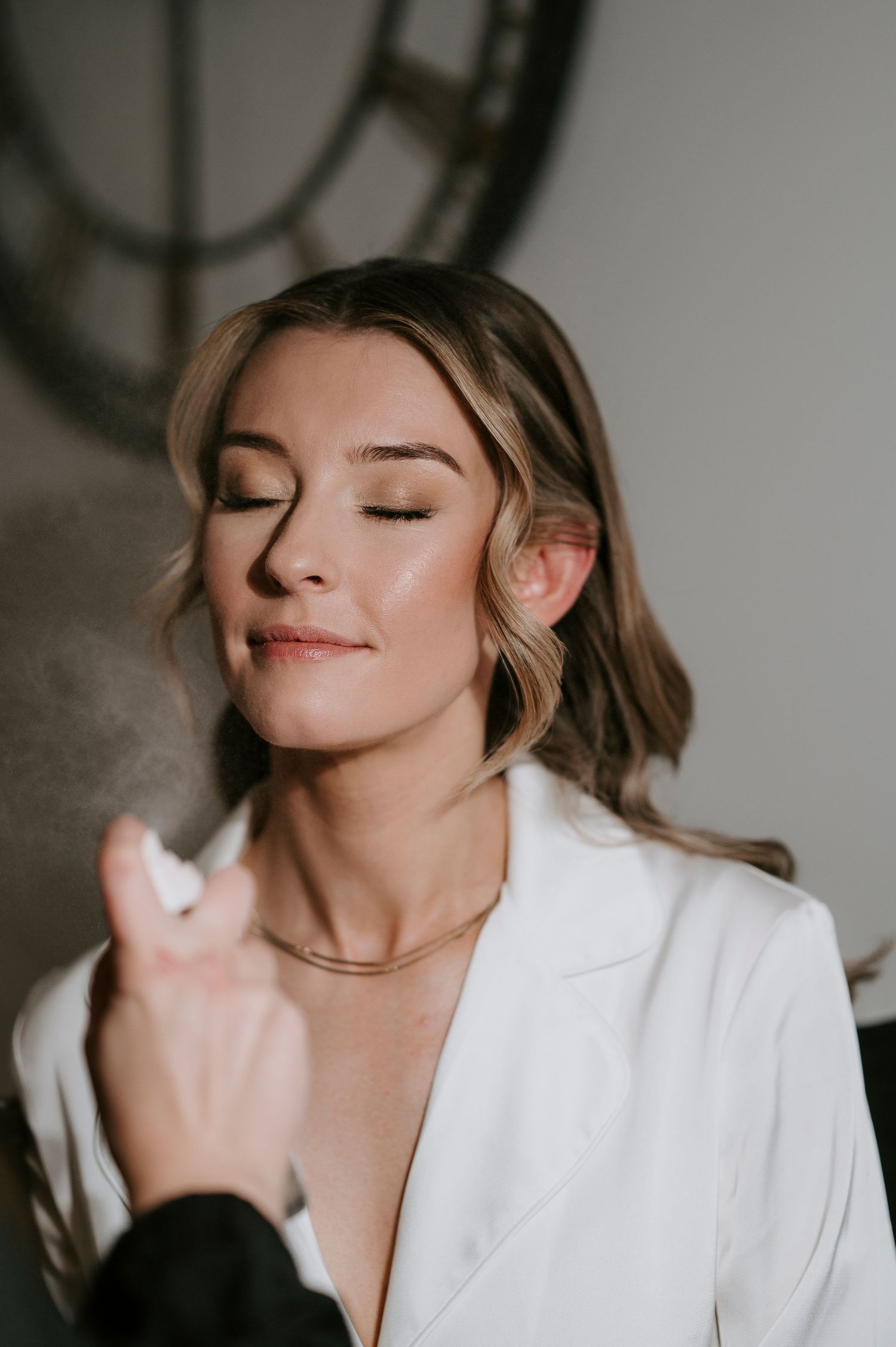 A sequence of artistic portrait shots showing relaxed expressions in a white shirt against a dark background.