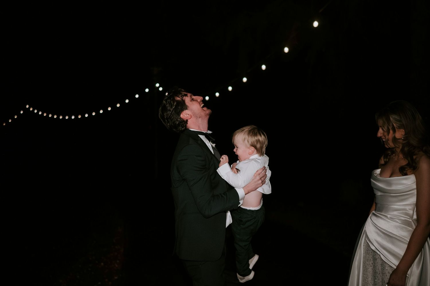 A sequence of romantic nighttime wedding photos showing couples dancing under twinkling string lights.