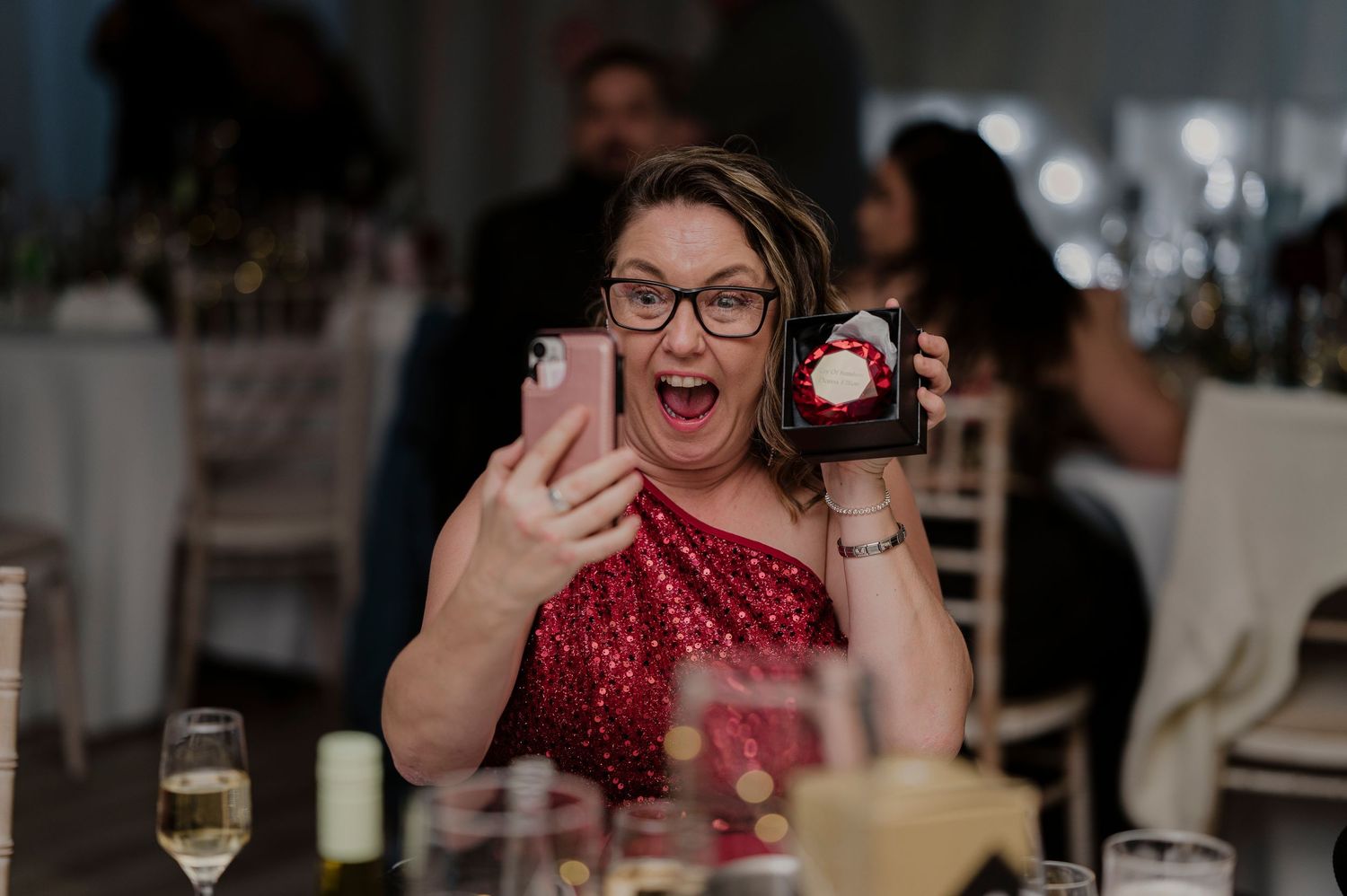 A series of candid photos showing people laughing and enjoying themselves at what appears to be a wedding reception.