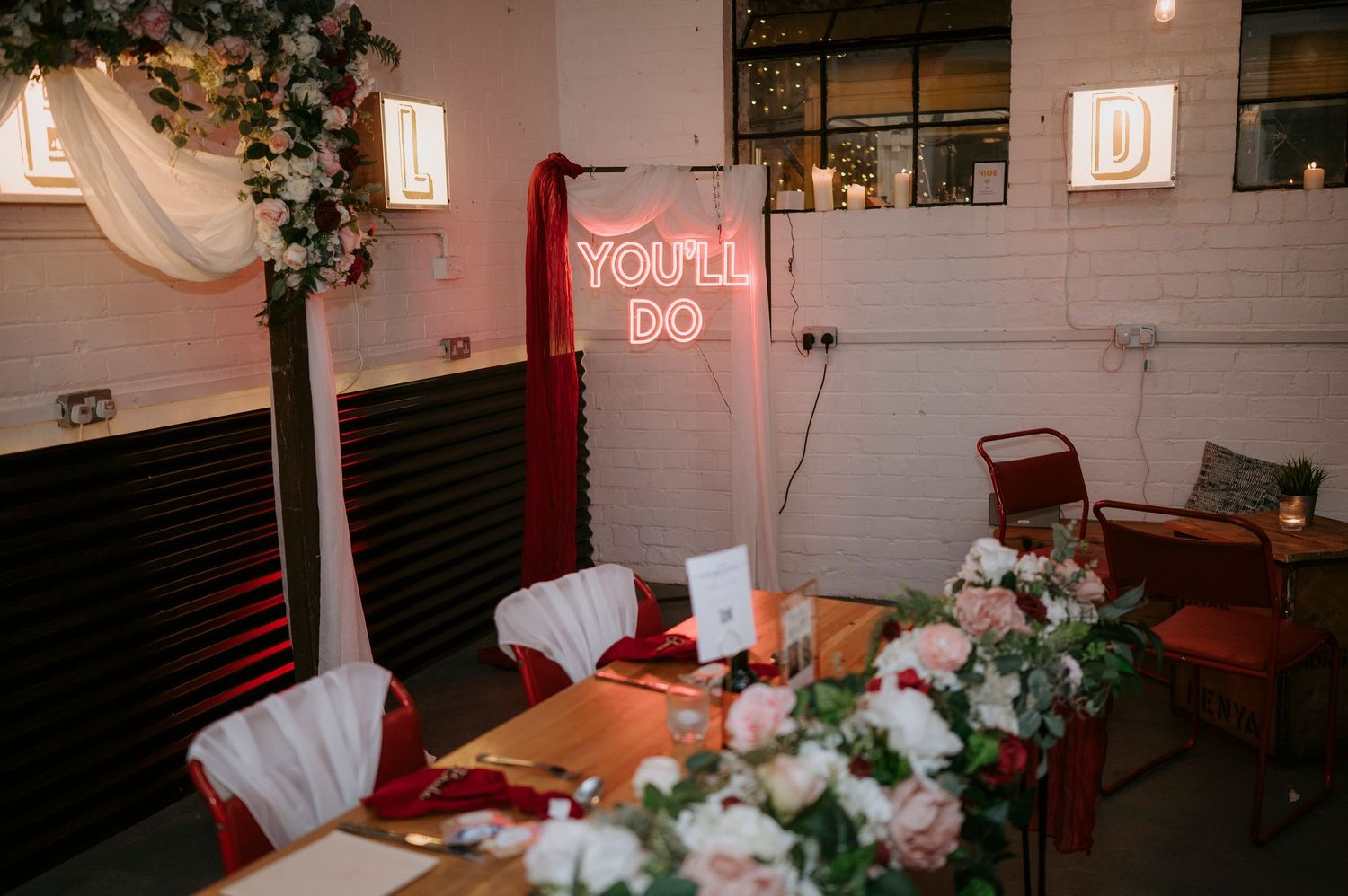 Romantic wedding reception venue with neon 